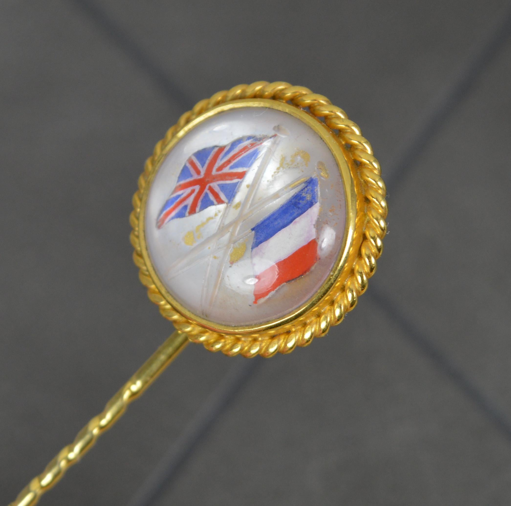 A stunning example of a late Victorian era stick / tie pin.
Solid 18 carat yellow gold.
Designed with a circular panel to top, Reverse essex crystal design with the UK and France flags. 

CONDITION ; Very good for age. Crisp design. Issue free.