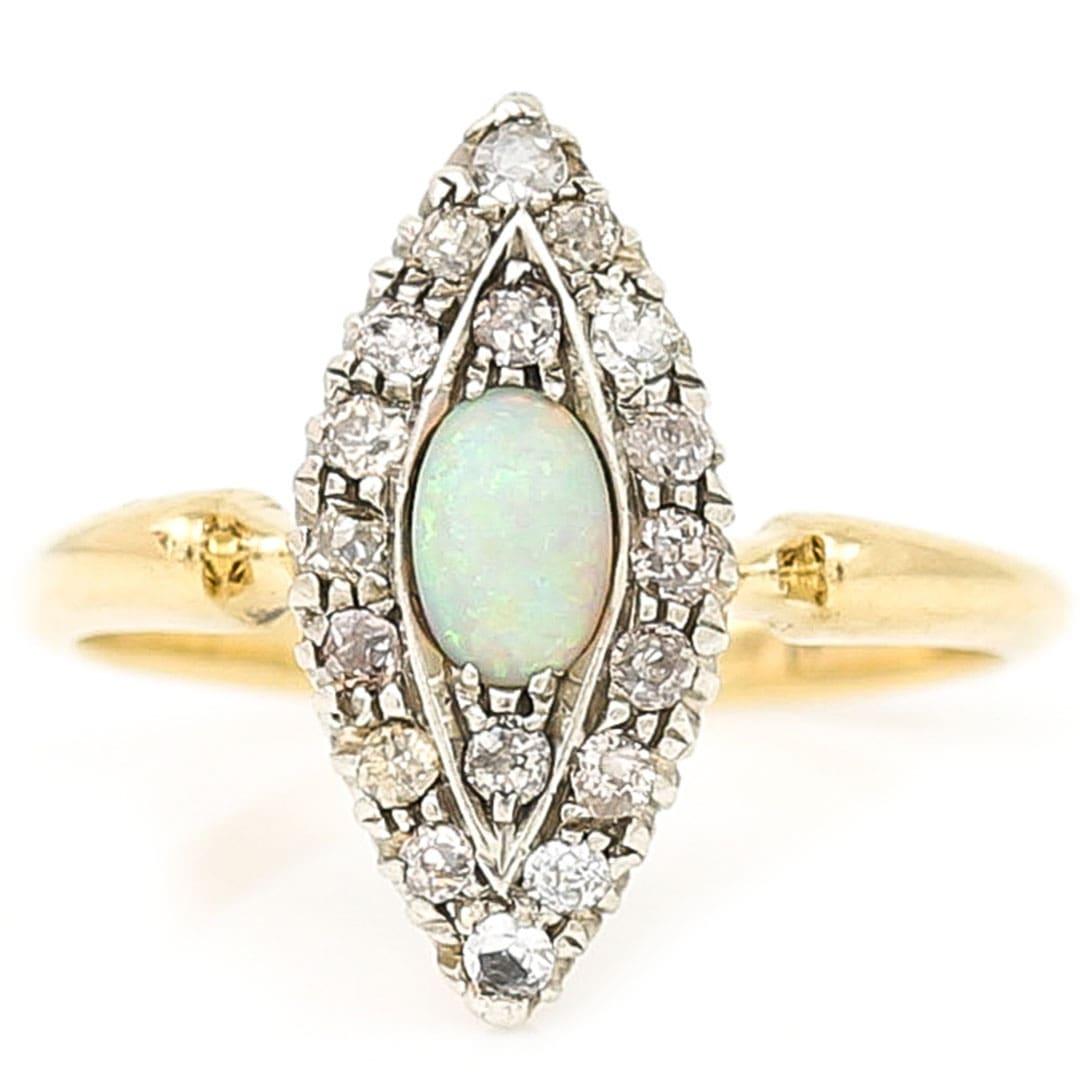 A beautiful 19th century marquise-shape or navette cabochon opal and old cut diamond ring dating from circa 1900. With an estimated 0.30ct of silver set, old cut diamonds the ring’s shape was used to elongated the finger and make its appear more