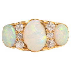 Victorian 18ct Gold Opal 
Diamond Trilogy Ring