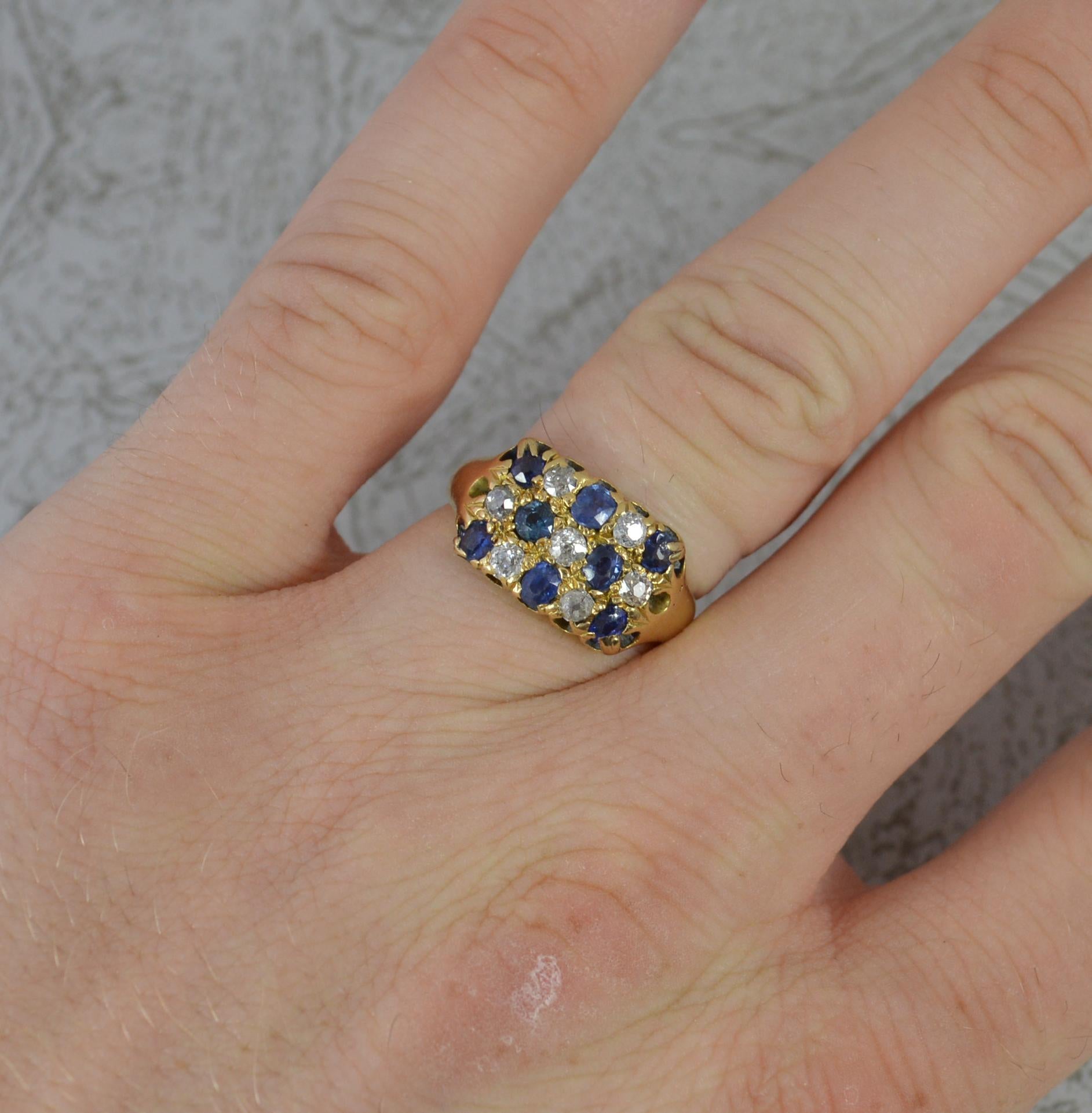 A superb and rare chequerboard design cluster ring.
Solid 18 carat yellow gold example.
Designed as a 5x3 row of alternating old cut diamonds and sapphires, all natural.
14mm x 10mm cluster head.

CONDITION ; Good for age. Clean, solid band. Well