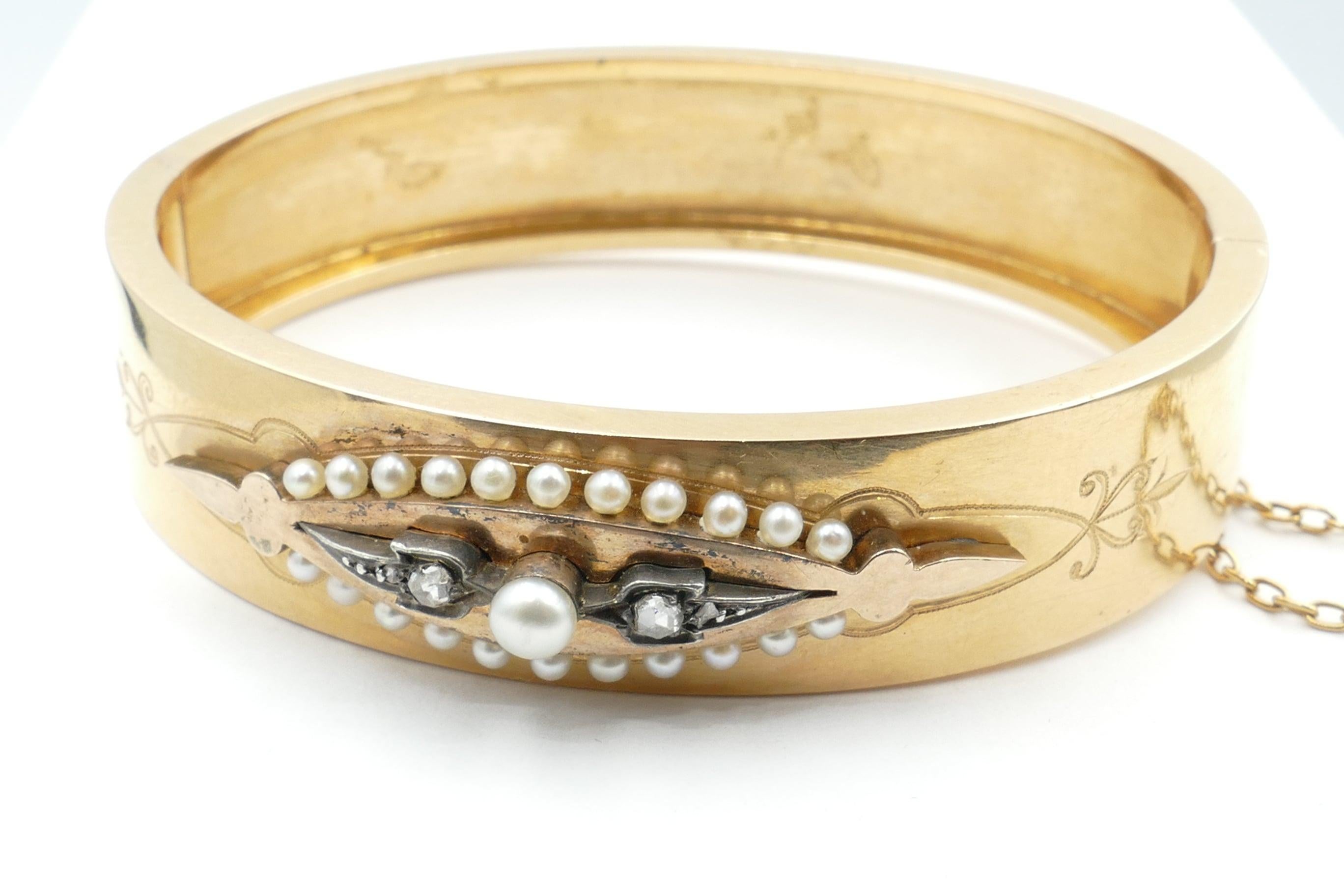 This Victorian 18ct Rose (has tinges of yellow Gold as well) Gold Bangle is hinged with an inner diameter of 57mm.
It features a centre Cultured Pearl, white in colour, button style in shape, 3.9mm in diameter with very good lustre and only minor