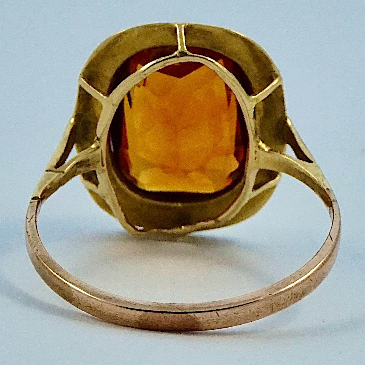 Victorian 18ct yellow gold ring set with a cushion cut citrine, ring size UK N, US 6 1/2. It is unmarked, but tests as 18ct gold. The rose gold band tests as 9ct gold and is probably a replacement band dating to circa 1920s. The citrine is 1.15cm /