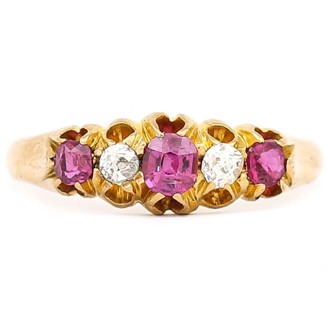 A beautiful late Victorian 18ct yellow gold ruby and diamond five stone ring, dating from 1894. The pretty pinkish red rubies totalling 0.35ct are slightly graduated mixed cut stones and are securely set in a hand crafted pierced claw setting. The