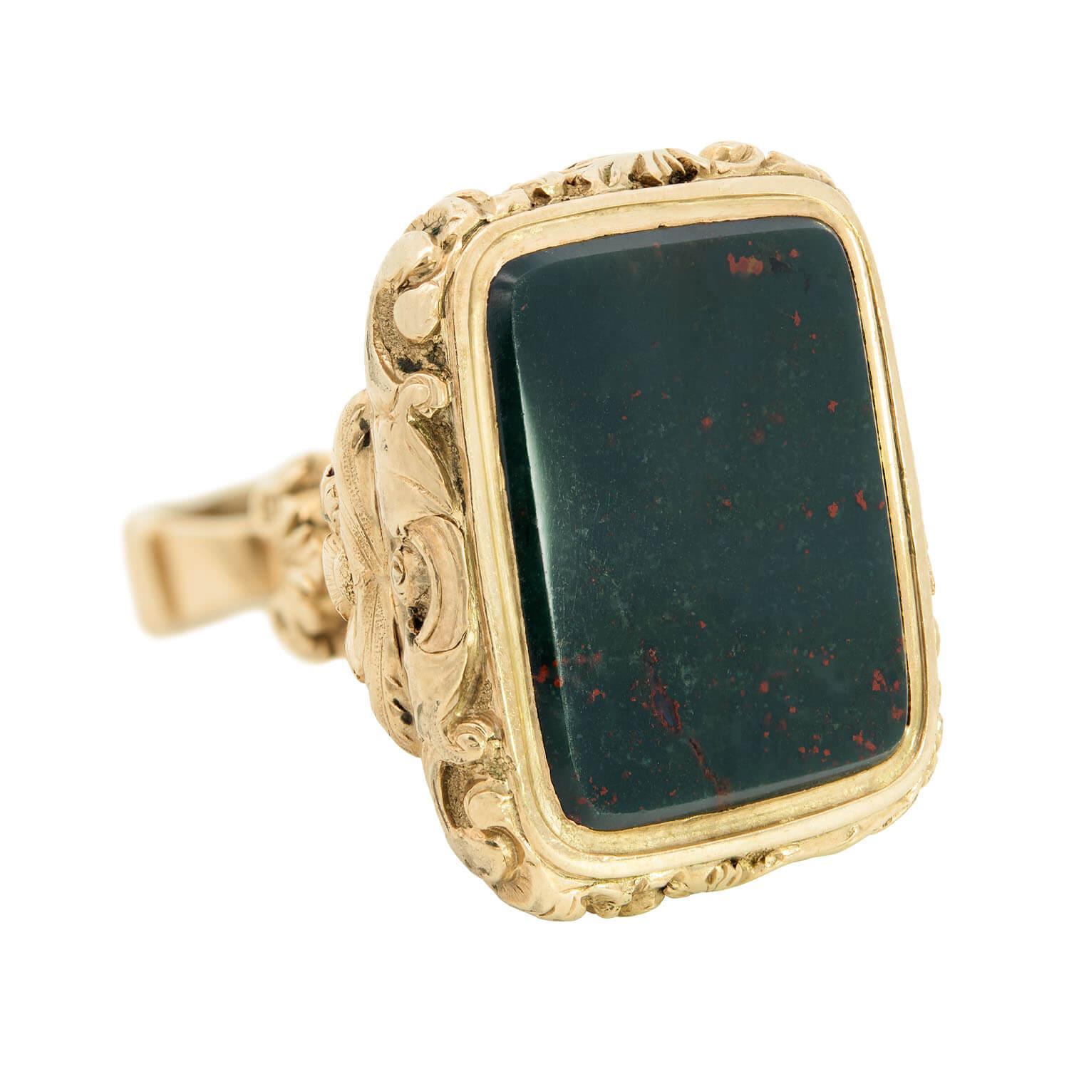 A fob is an adornment or a seal that hangs from the ribbon or chain of a pocket watch. Its purpose is to decorate or add weight to the watch chain itself, making it easier for the watch to be withdrawn from a pocket.

A wonderful bloodstone fob from