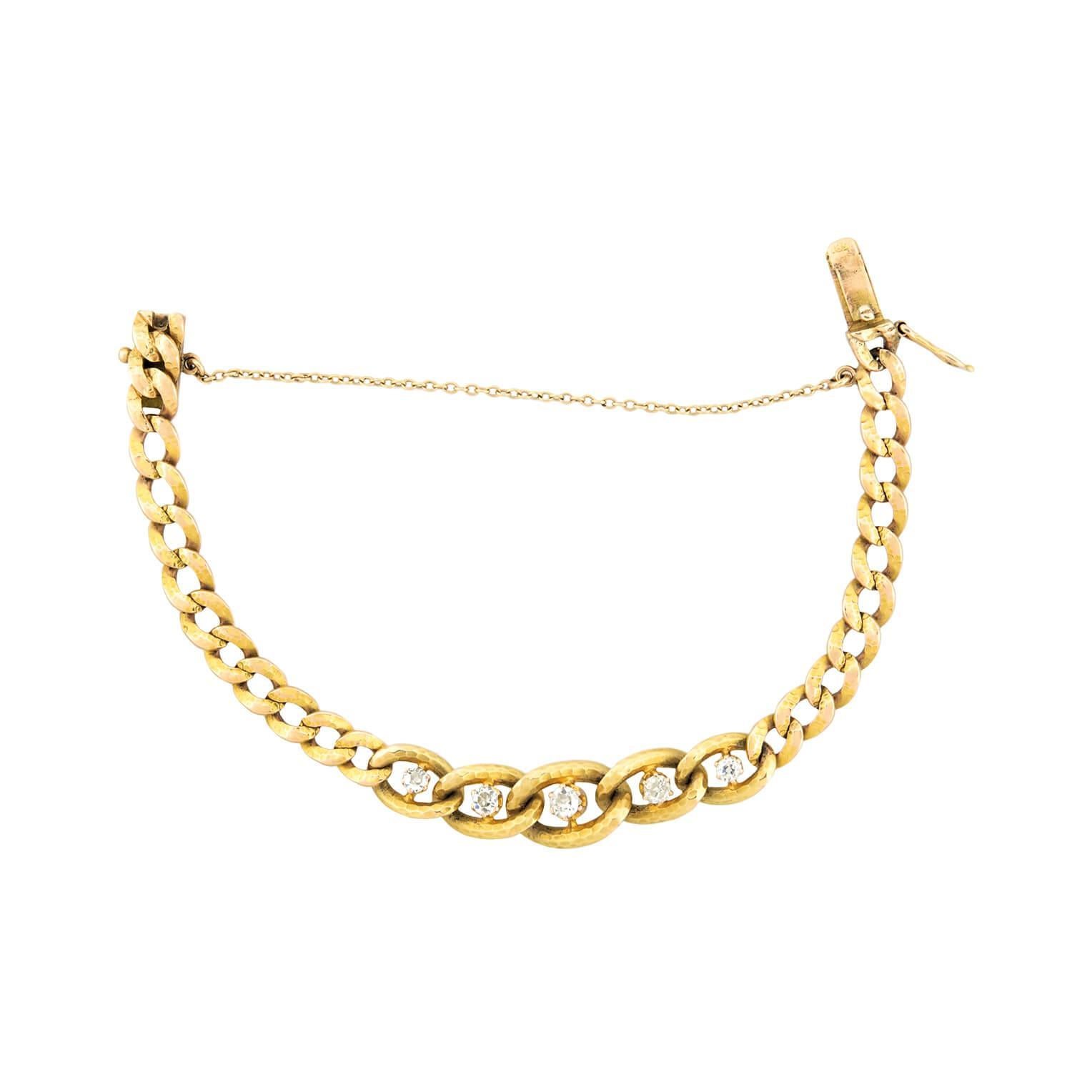 A stunning diamond link bracelet from the Victorian (ca1880s) era! Crafted in 18k yellow gold, this fantastic piece is comprised of 28 graduated curb links that form a flexible design that wraps comfortably around the wrist. The links have a unique