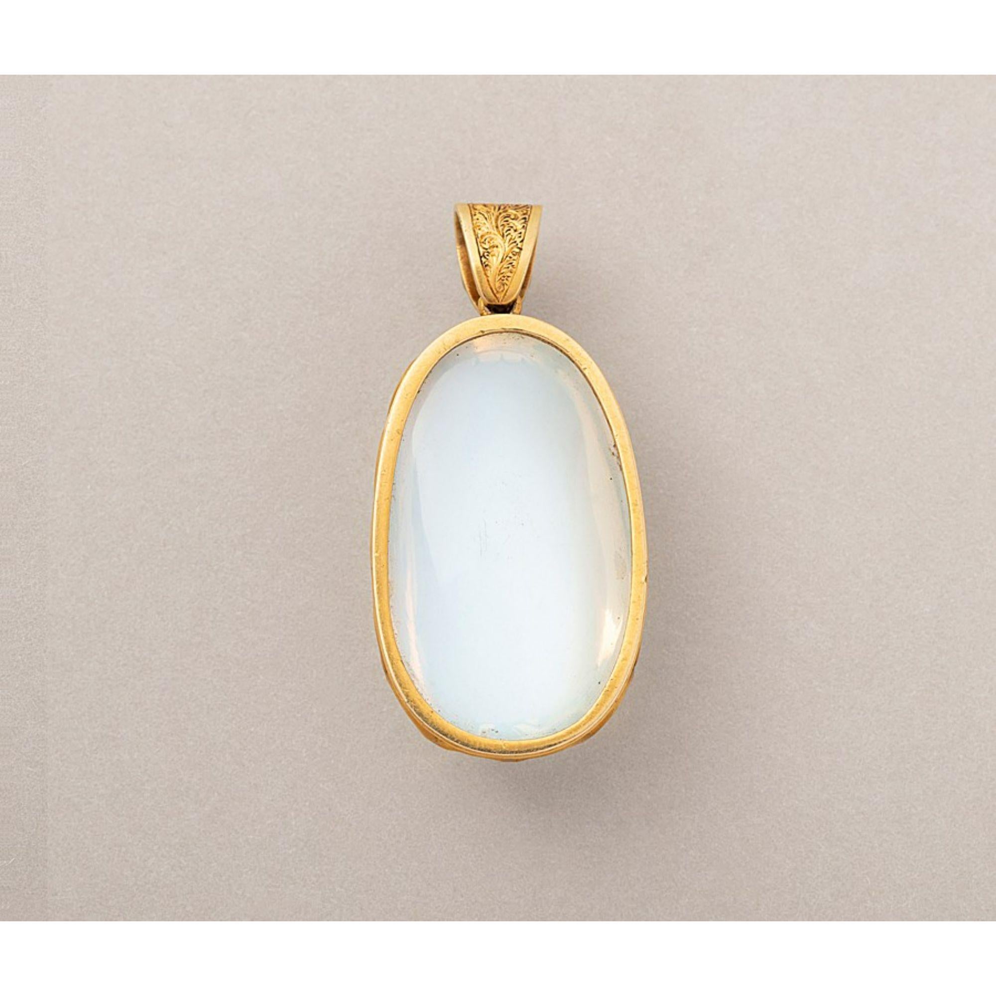 An 18 carat gold pendant set with a large, oval-pear, cabochon cut moonstone open set in fourteen elegant claws, most likely English in origin, circa 1890.

Additional information:
Period: Victorian
Weight: 16.13 grams
Dimensions: 40 x 19 mm