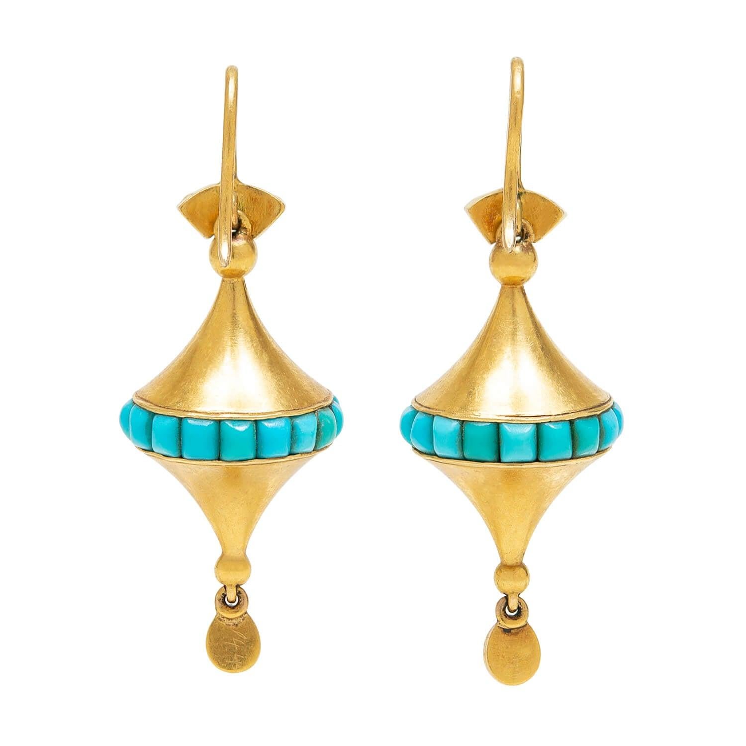 A beautiful pair of turquoise and gold earrings from the Victorian (ca1880s) era! These earrings have a lovely rhombus design and look simply wonderful when worn. Each earring begins with a decorative 18kt gold topper, which holds two turquoise