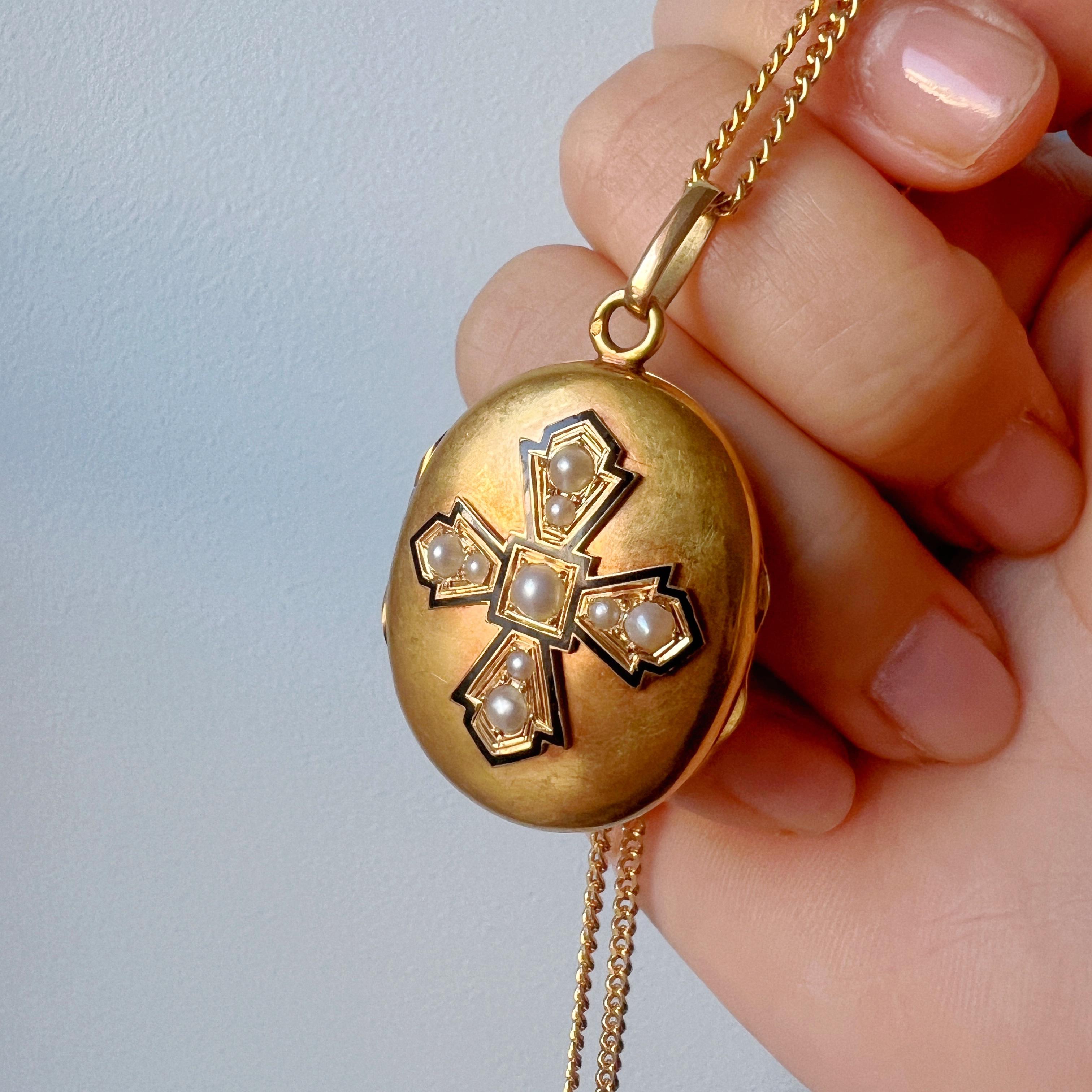 For sale a magnificent French work, Victorian era 18K gold locket pendant.

The front of the locket is adorned with a meticulously crafted black enamel cross, a symbol of faith, hope and benediction. Surrounding the cross are nine white half-pearls