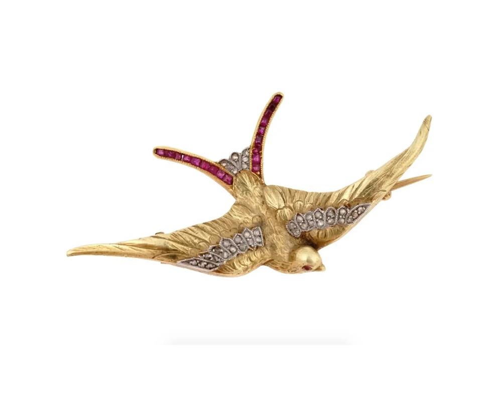 An antique late 19th century 18K yellow gold pin brooch representing a swallow bird. The piece is garnished with diamonds and cut ruby stones. Fine detail work. Crown mark and hallmark traces are on the pin. Total Weight: 7 grams. Victorian Era