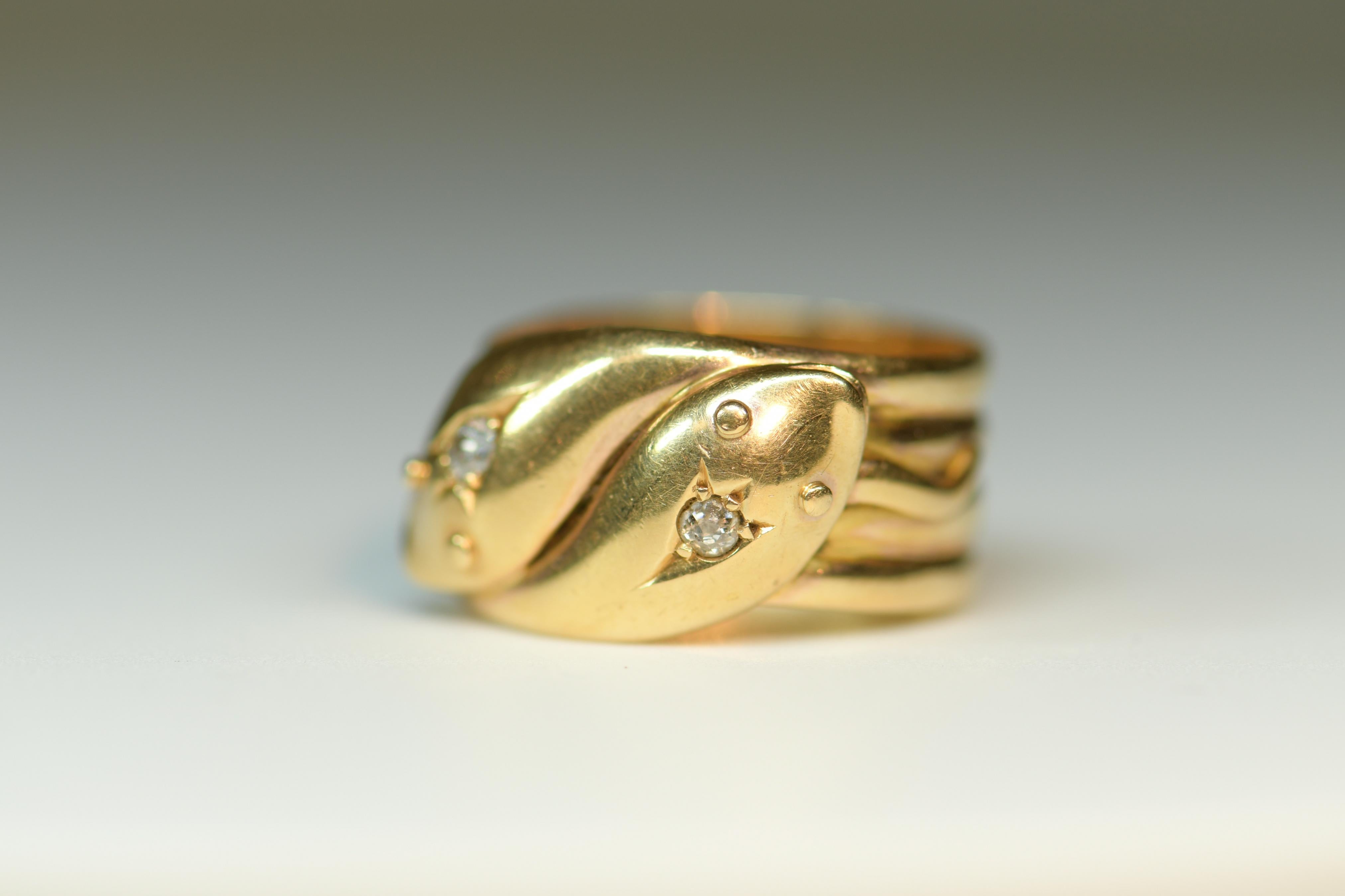 A charming 18ct gold snake ring. The snake’s eyes are set with small diamonds. The snake motif in antique jewelry represented “Eternal love and wisdom”, so this ring with it’s two entwined snakes represented the love between two people. What a