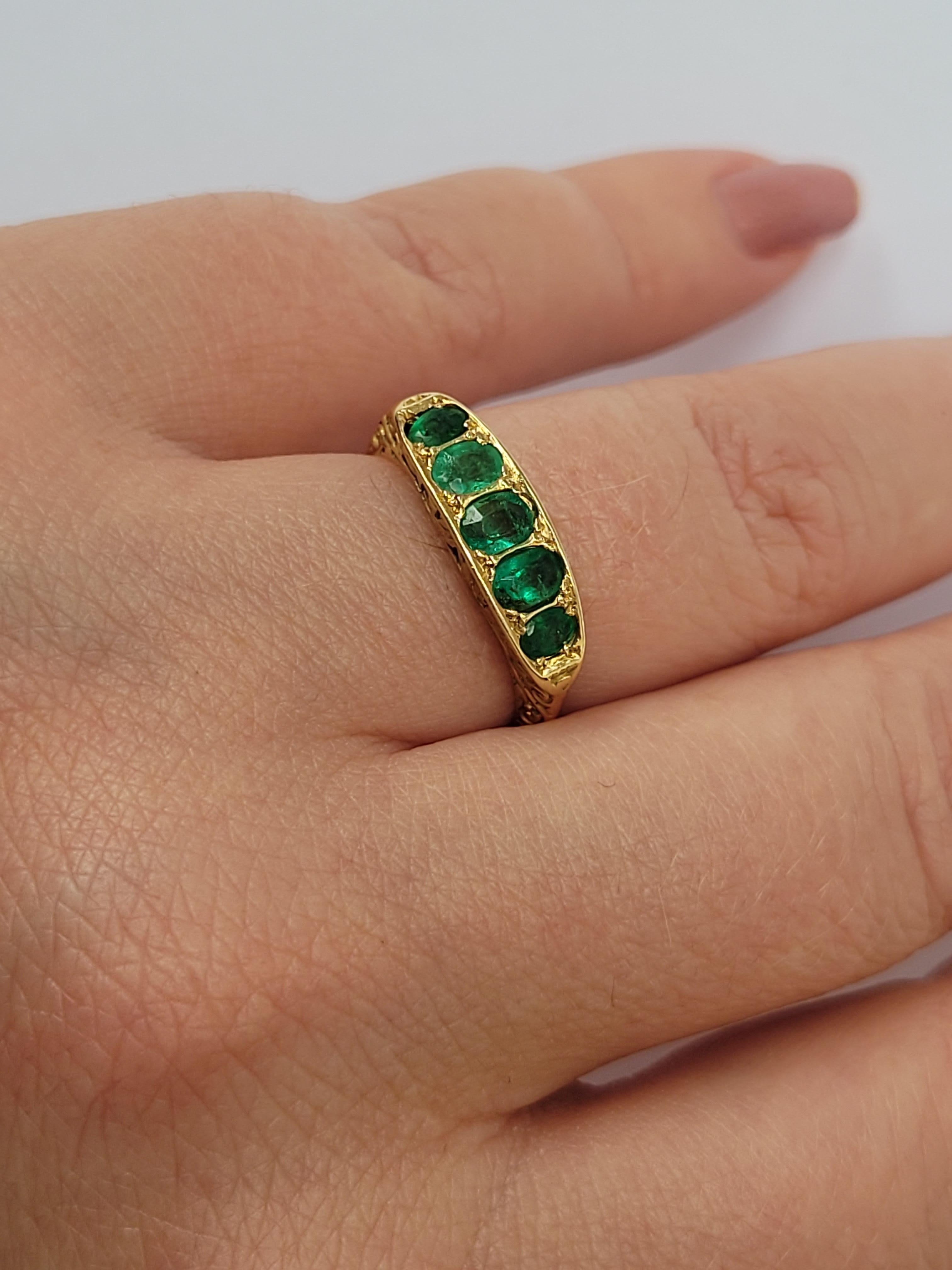 A lovely antique Victorian 18 Karat Gold and five Emerald ring. The stones in beautiful setting. Perfect as everyday ring or gift for someone special. English origin. 

Size M 1/2 UK, 6.75 US.
Height of the face 5mm.
Weight 4.2gr.
Marked 18CT for 18