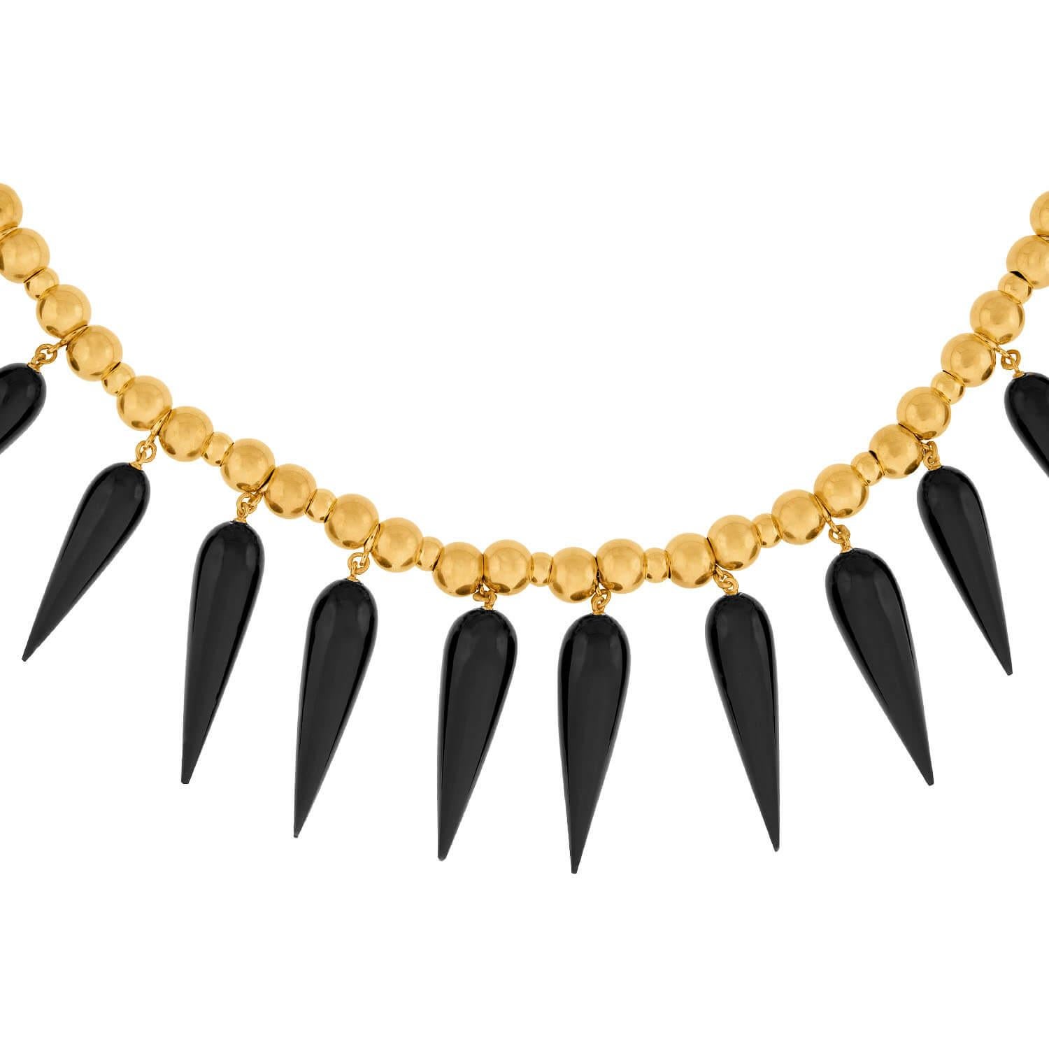 An absolutely stunning mourning necklace from the Victorian (ca1880) era. Crafted in vibrant 18k yellow gold, the necklace is comprised of a single strand of graduated gold beads which are strung on a gold chain. At the center of the necklace are 22