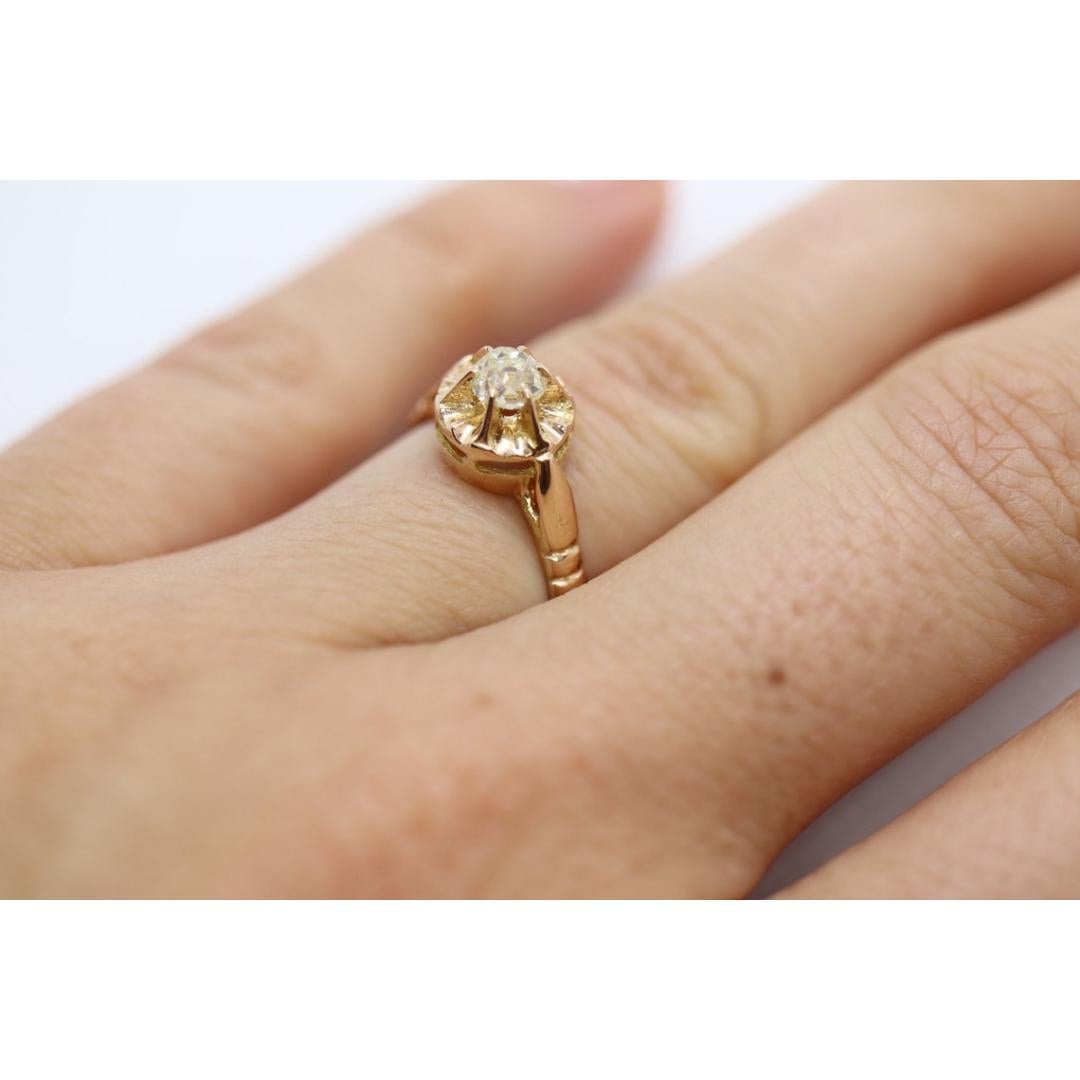 Vintage from the 1900s
Materials: Stone
Gemstone: Diamond
Gem Color: Colorless
Band Color: Rose gold

Style: Victorian

An Amazing Find. You will not find a ring like it anywhere. Victorian buttercup diamond setting. 18k Rose Gold setting and shank.
