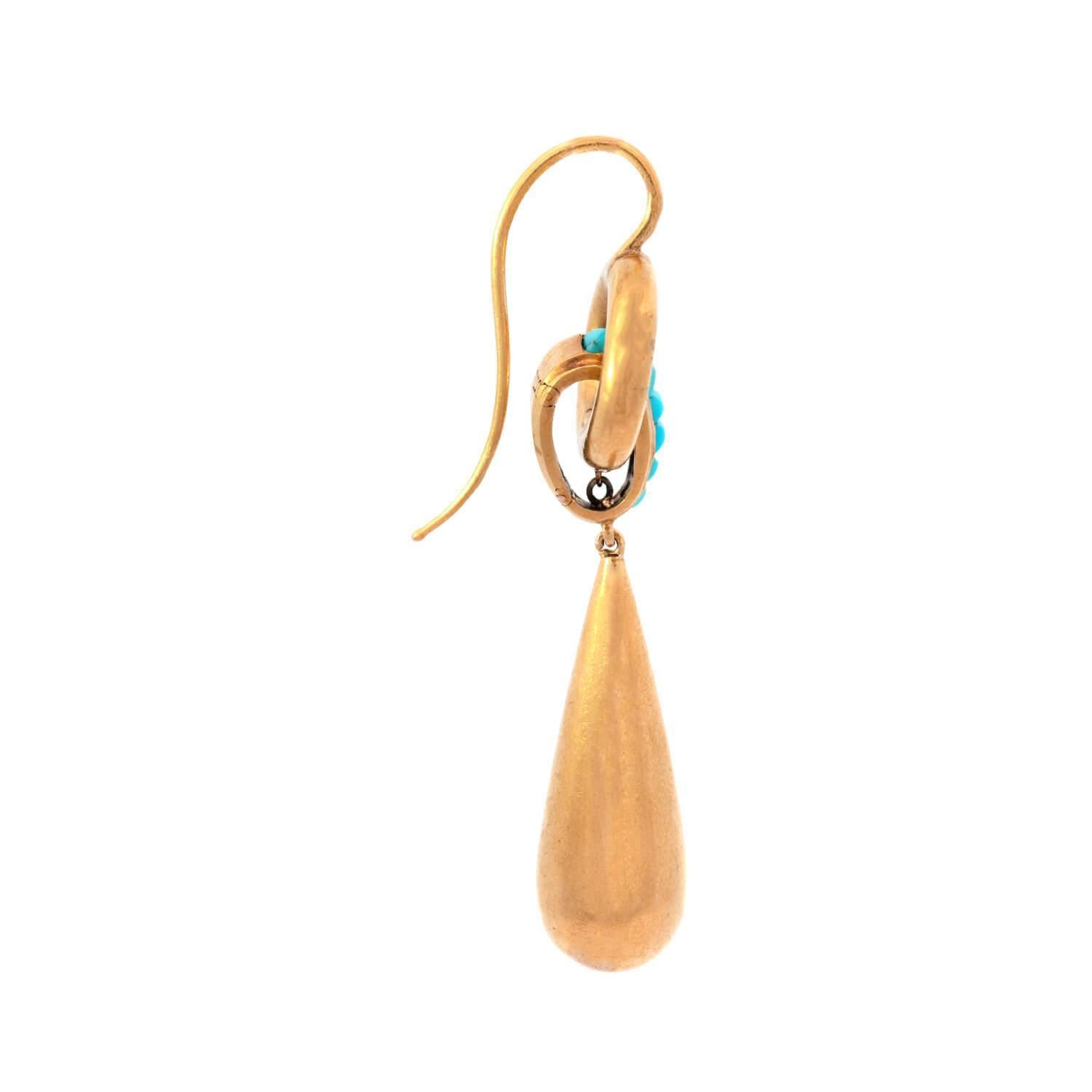 Wonderful gold earrings from the Victorian (ca1880s) era! Crafted in vibrant 18k yellow gold, each earring begins with a circular hoop, which acts as the surmount. Another, smaller link is connected to the hoop, and is decorated with 6 turquoise