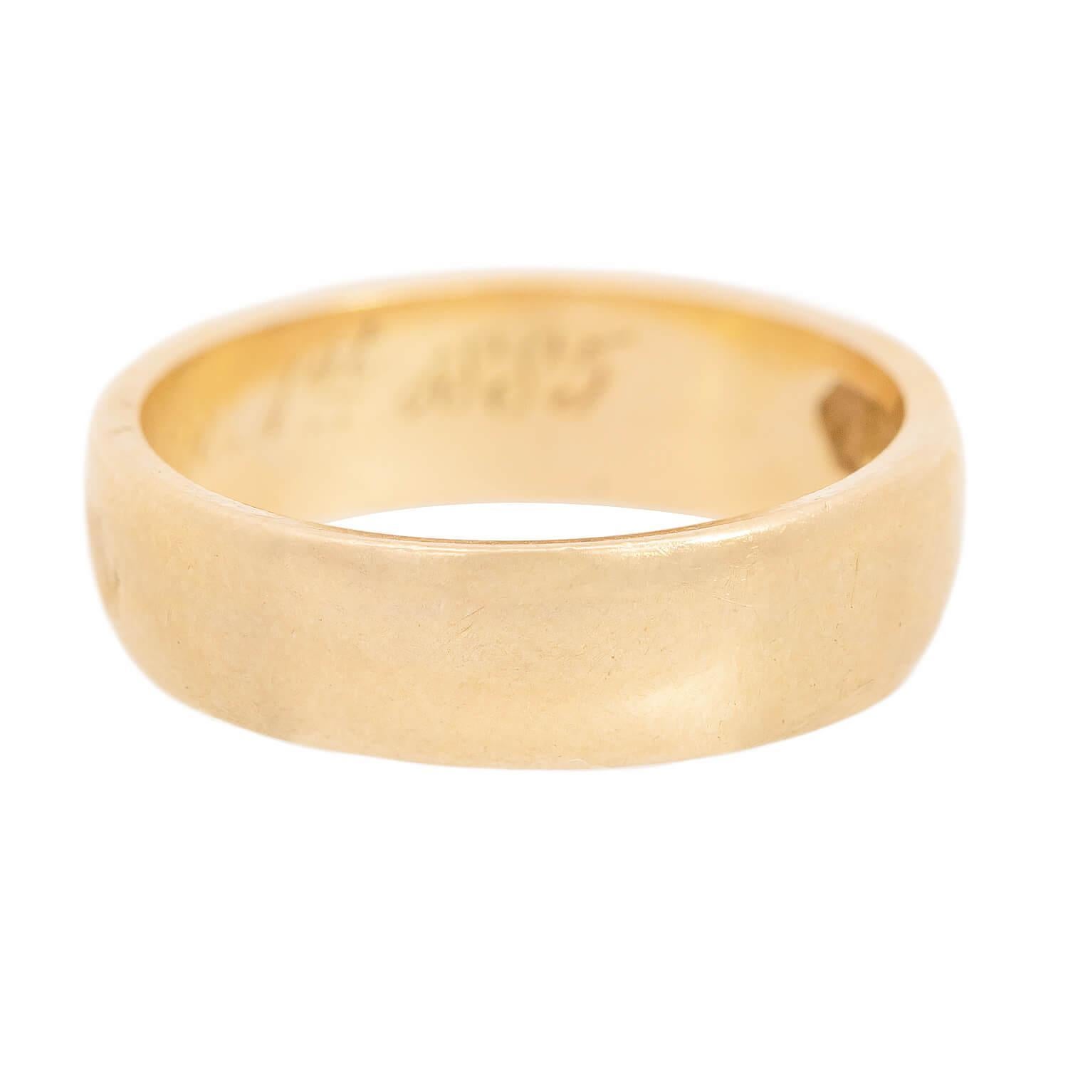 A gorgeous wedding band from the Victorian (ca1880s) era! Crafted in 18k vibrant yellow gold, this ring is smooth and simple. The inside of the ring features an original personal engraving which reads: 