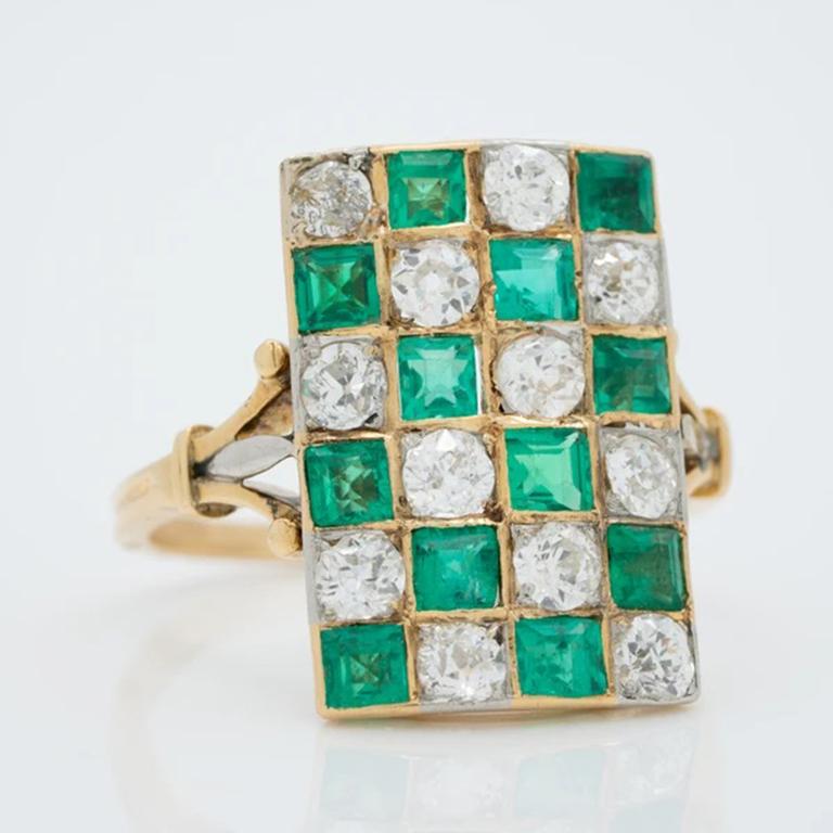 18k Yellow Gold Colombian Emerald and Diamond Checkerboard Plaque Ring c.1900. 

Forged at the very end of the Victorian era, this magnificent plaque ring is as dazzling as an antique treasure can be. Twelve old European cut diamonds (for a total of