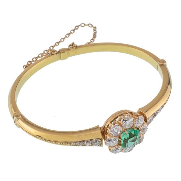 Victorian 18K Yellow Gold and 2.0Ct Colombian Emerald and 3.0cts. Old European Cut Halo Bangle

Additional Information:
Period: Victorian
Year: 1880s
Material: 18k Yellow Gold, 2.0CT Colombian Emerald, 3.0cts. Old European Cut Diamonds
Weight: