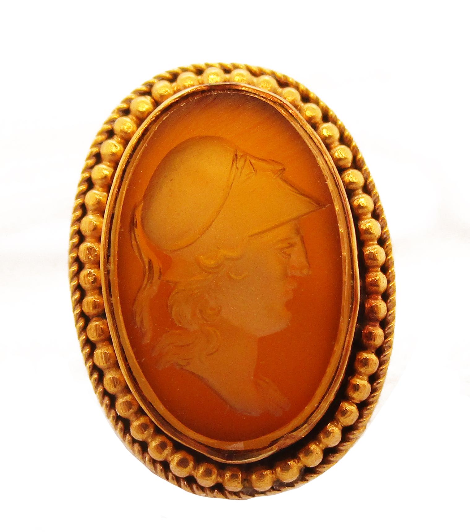 This stunning set of Victorian cufflinks boast a rich, dark 18k yellow gold frames and magnificent intaglio carved citrine panels. The carving features the profiles of two Greek warriors, possibly that of Achilles and Hector, separated only by the