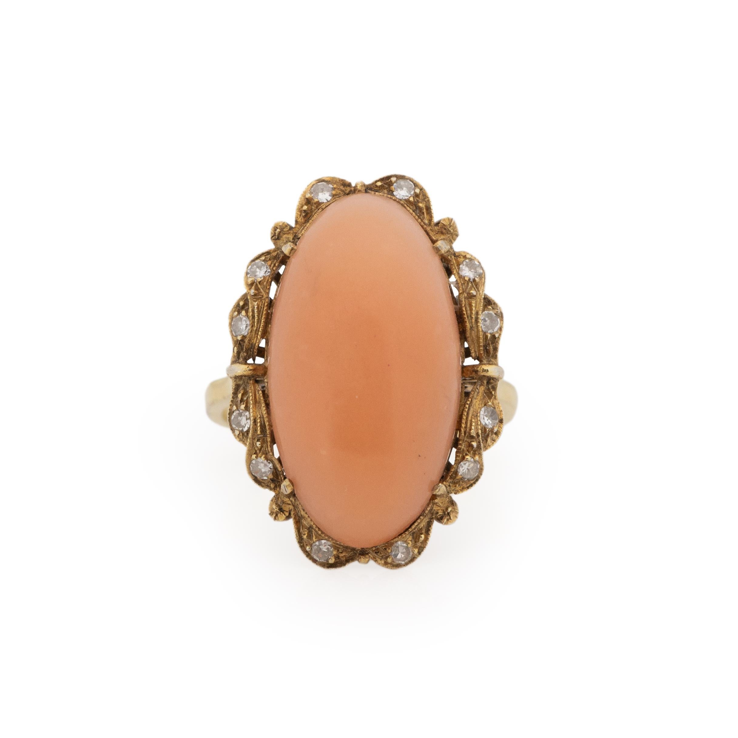 This Victorian show piece is crafted in a rich 18K yellow gold. The smooth tapered shanks takes the eye up to a simple gallery. Being held in the gallery is a beautiful oval cabochon of coral that is a pale peachy orange color. This color is called