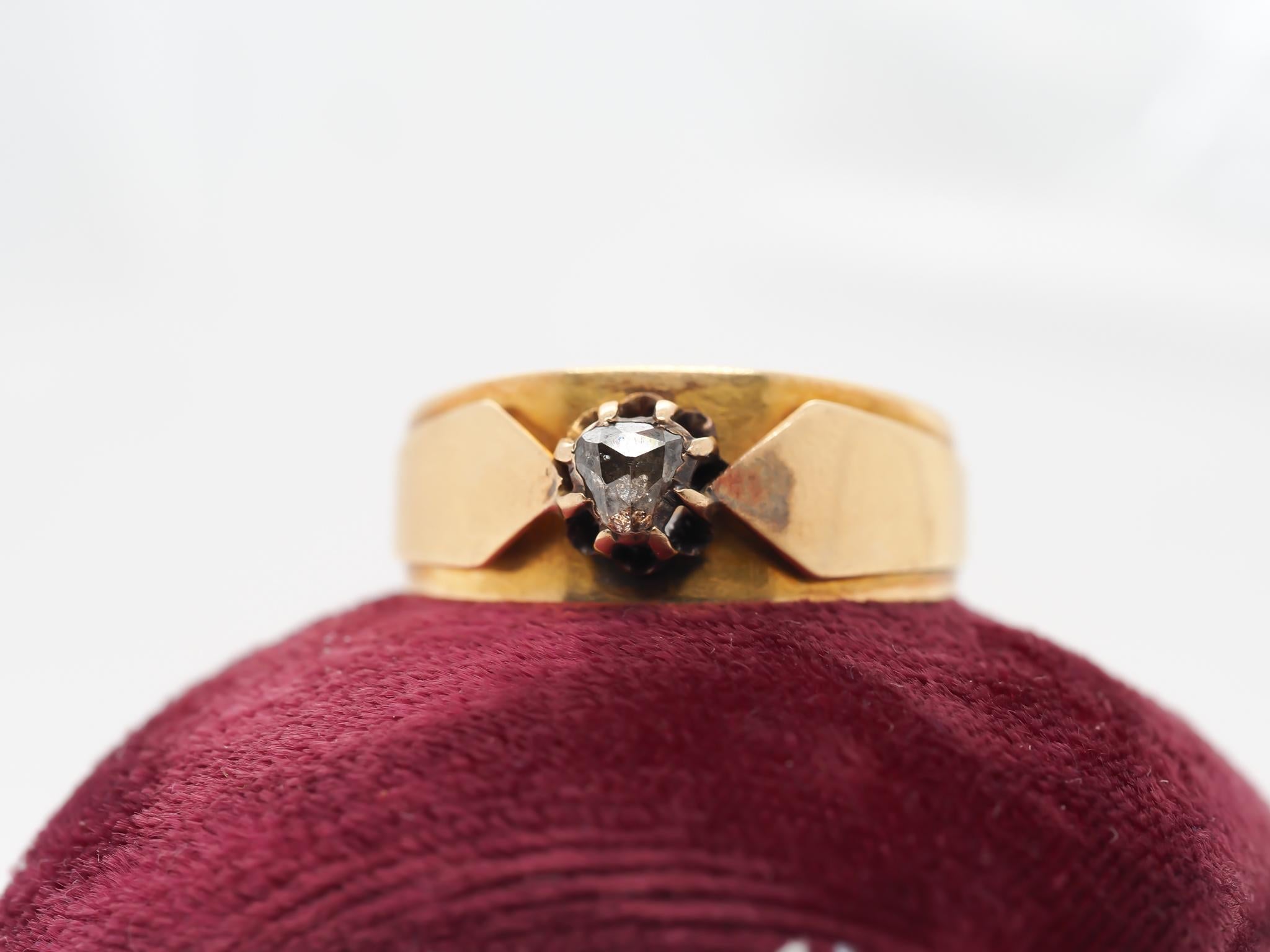 Year: 1890s
Item Details:
Ring Size: 10.5 (Sizable)
Metal Type: 18K Yellow Gold [Hallmarked, and Tested]
Weight: 6.70 grams
Diamond Details: Rose Cut Diamond, .15ct, K/L, VS Clarity
Band Width: 5 mm
Condition: Excellent
Victorian