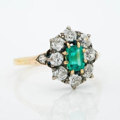 Victorian 18K Gold and Silver and 1.0 Carat Emerald and 1.50 Carat Diamond Halo