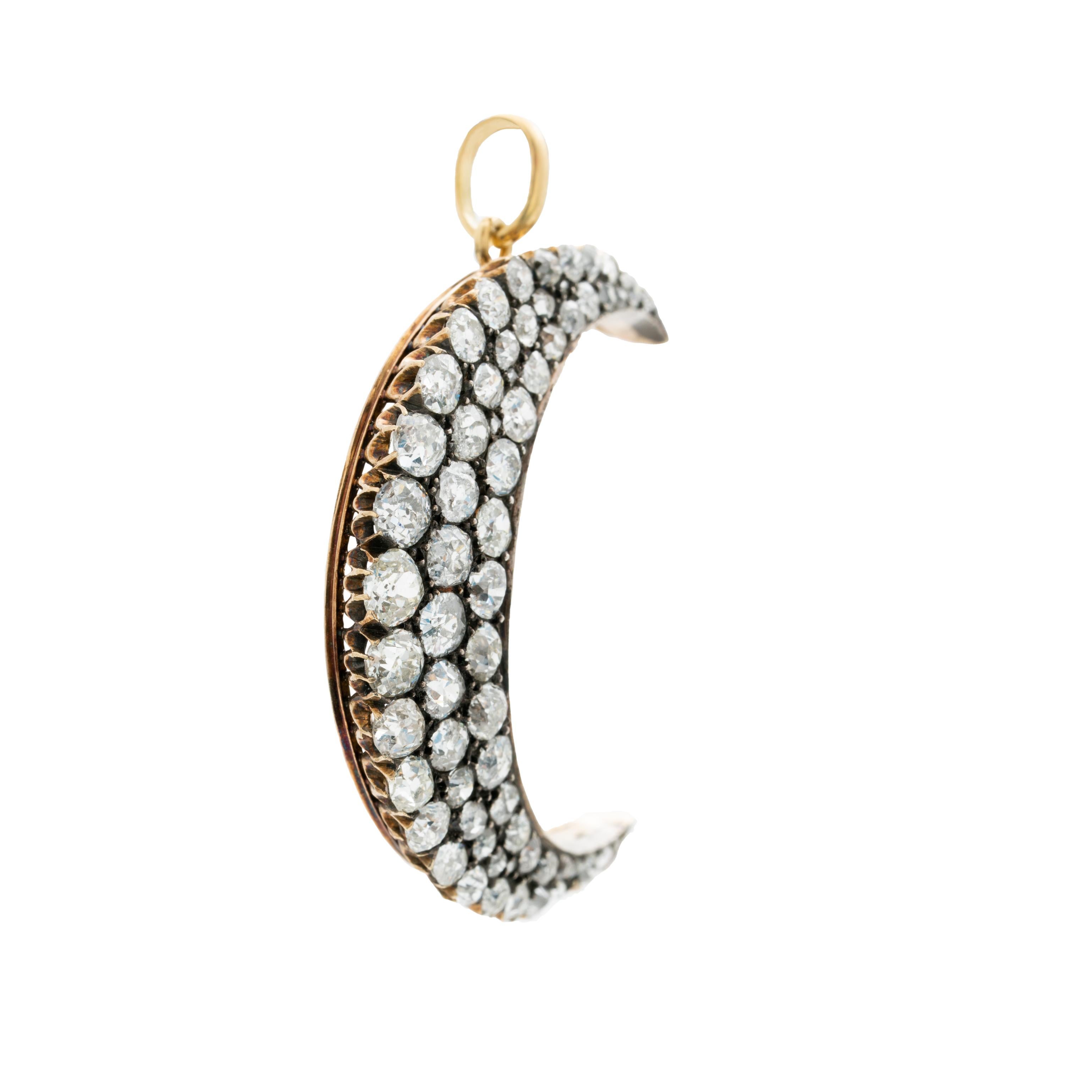 VICTORIAN 18K YELLOW GOLD, SILVER AND 7.25CTS. DIAMOND CRESCENT MOON c.1860s

Period: Victorian
Year: 1860s
Material: Gold, Silver, 7.25cts. Old Mine Cut Diamonds
Weight: 7.77g
Length: 40.25mm/1.58 inches 
Width: 32.16mm/ 1.26 inches
Condition: