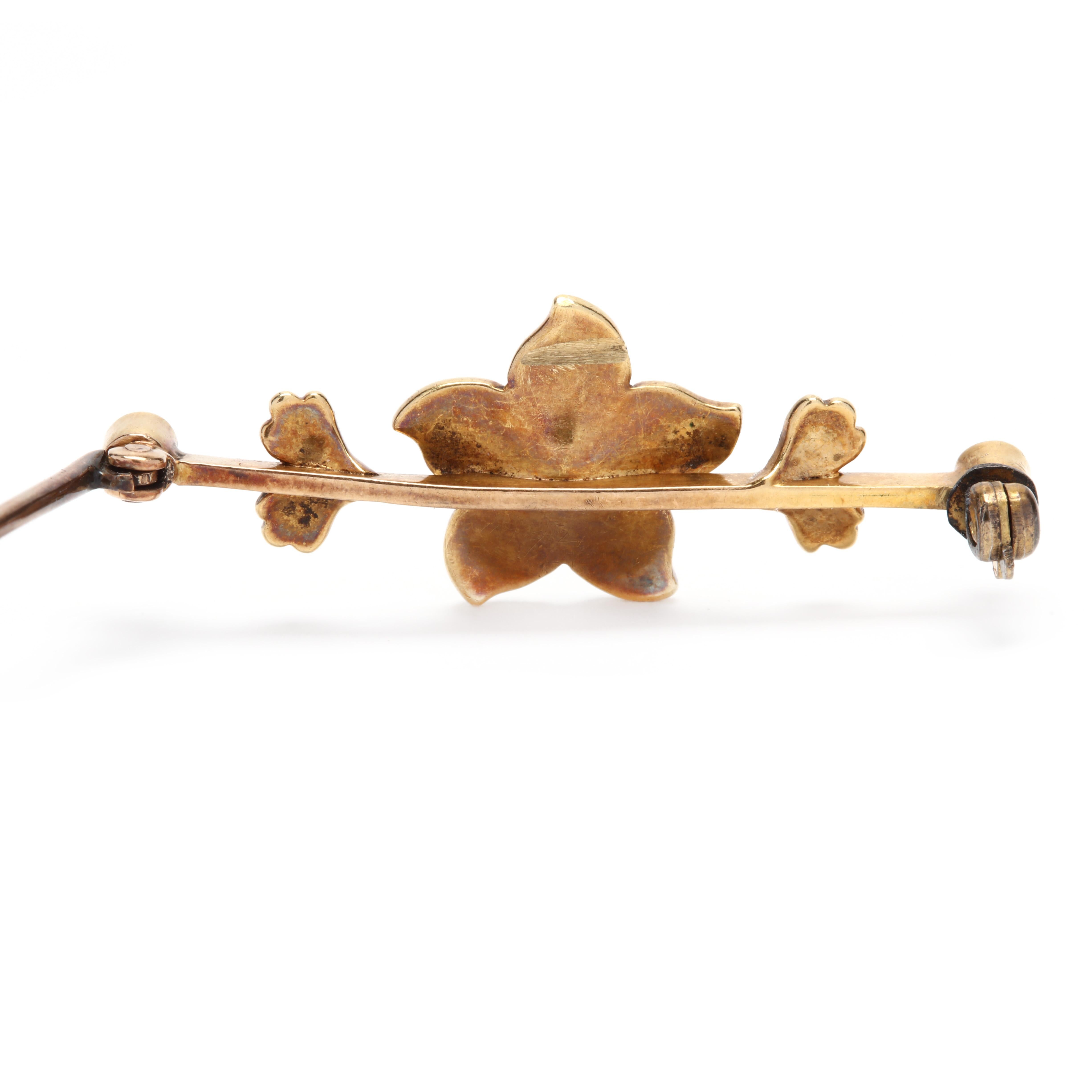 A Victorian 18 karat yellow gold and split pearl floral bar brooch. Of a linear design with a central flower motif in the center set with various sizes of split pearl, foliate motifs to each and a locking pin stem clasp.

Length: 1 1/2 in.
 
Width: