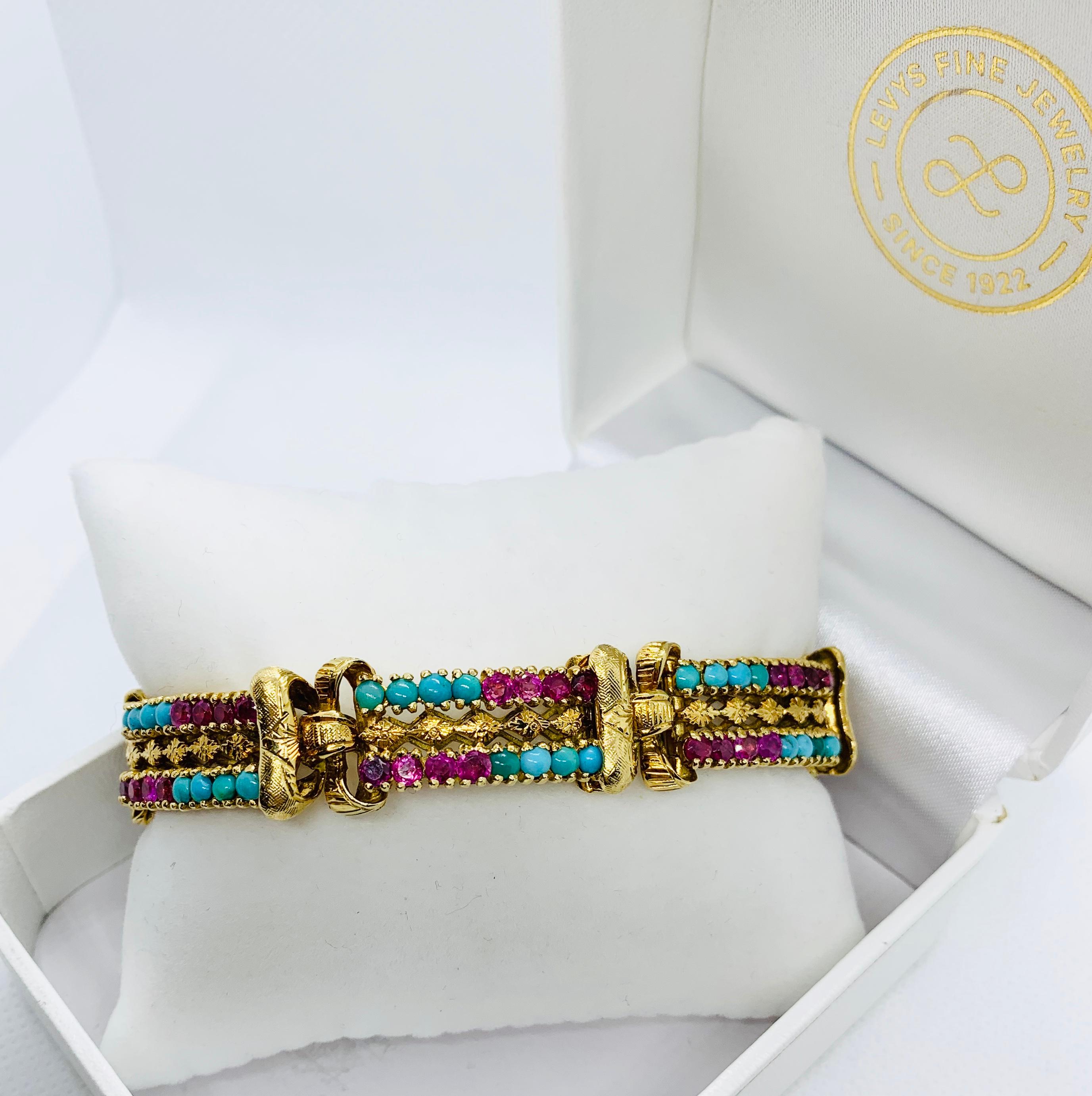 Absolutely Gorgeous Victorian Bracelet! Made in 18k yellow Gold that has been beautifully engraved. Each section has alternating rows of cabochon cut 3 mm turquoise ( total 48) and 3.2 mm rubies (Total 48). The rubies weigh an estimated 8 carats.
