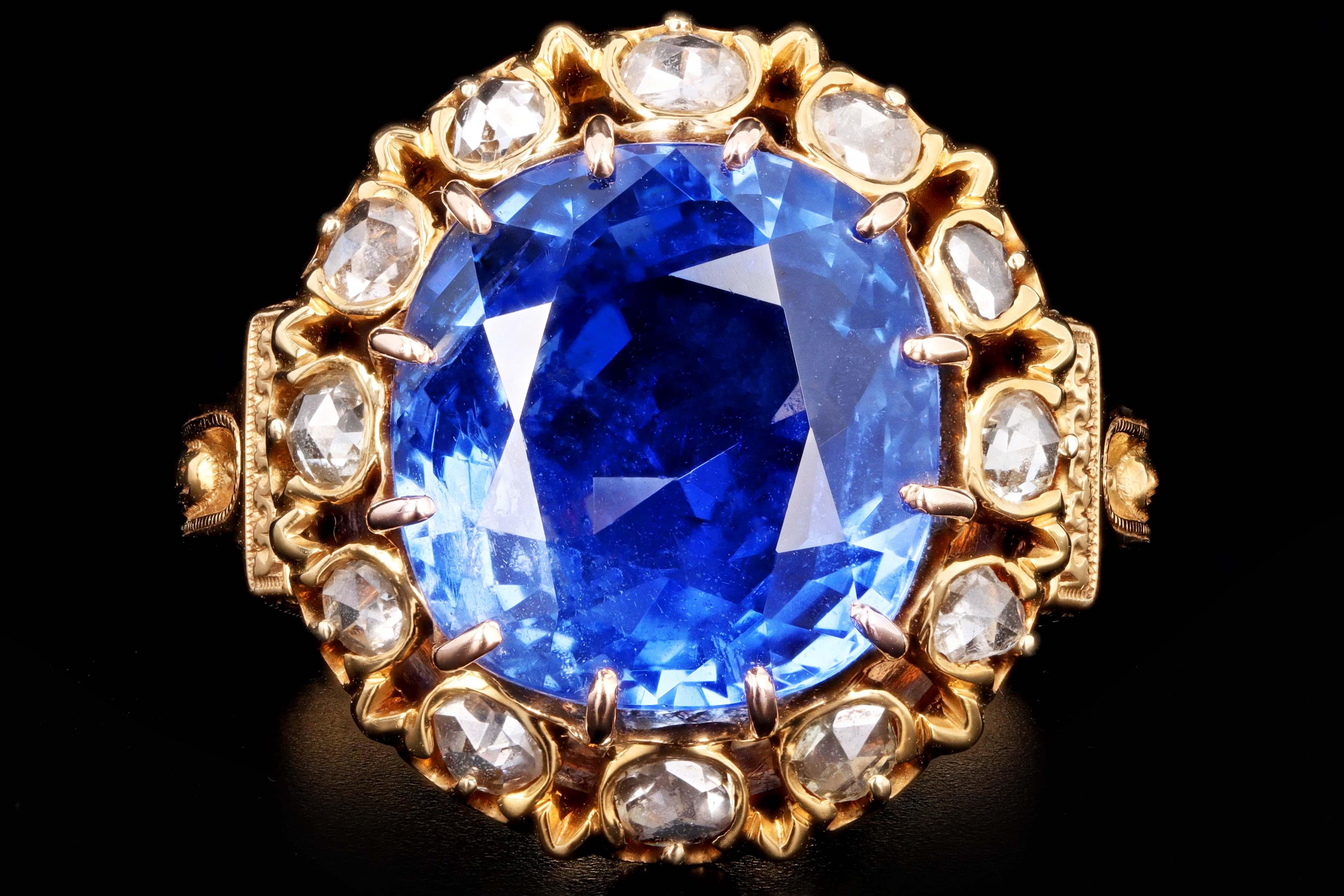 Era: Victorian 

Composition: 18K Yellow Gold 

Primary Stone: Natural, Untreated Burma(Myanmar) Sapphire 

Carat Weight: 10.73 Carats 

SSEF Gemstone Report Number: 71758

Accent Stone: Twelve Rose Cut Diamonds 

Ring Size: 8.25

Ring Weight: 10.1