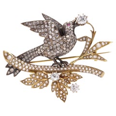 Broche victorienne en or 18kt et argent, oiseau debout sur une branche, avec diamants 