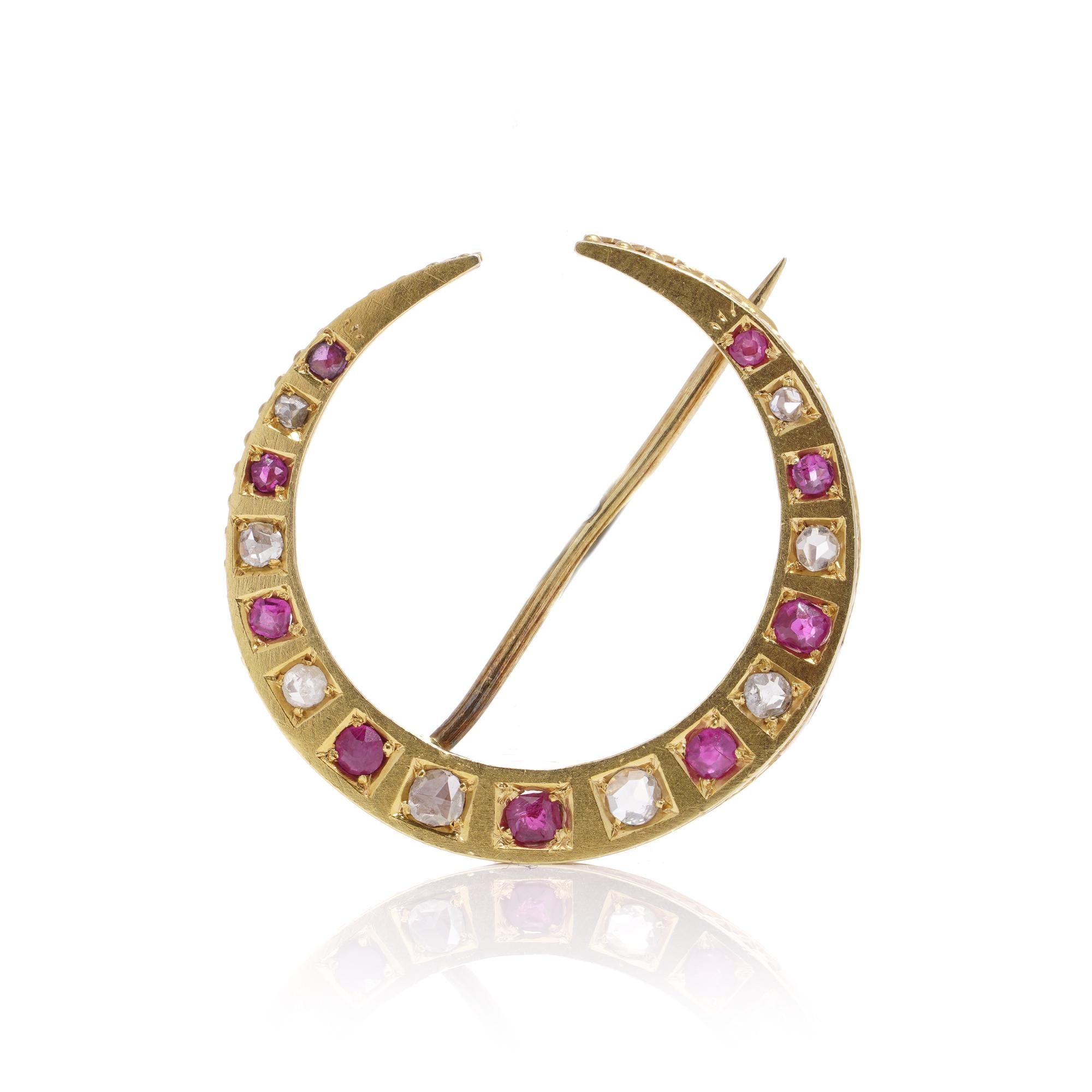 Antique Victorian 18kt yellow gold rose - cut diamond and round faceted ruby crescent brooch with safety pin chain. 

Dimensions:
Width: 2.7 cm
Height: 2.7 cm
Total weight: 4.00 grams 

Rubies  -
Quantity: 9 
Cut: Round faceted 
Carat weight: 0.25