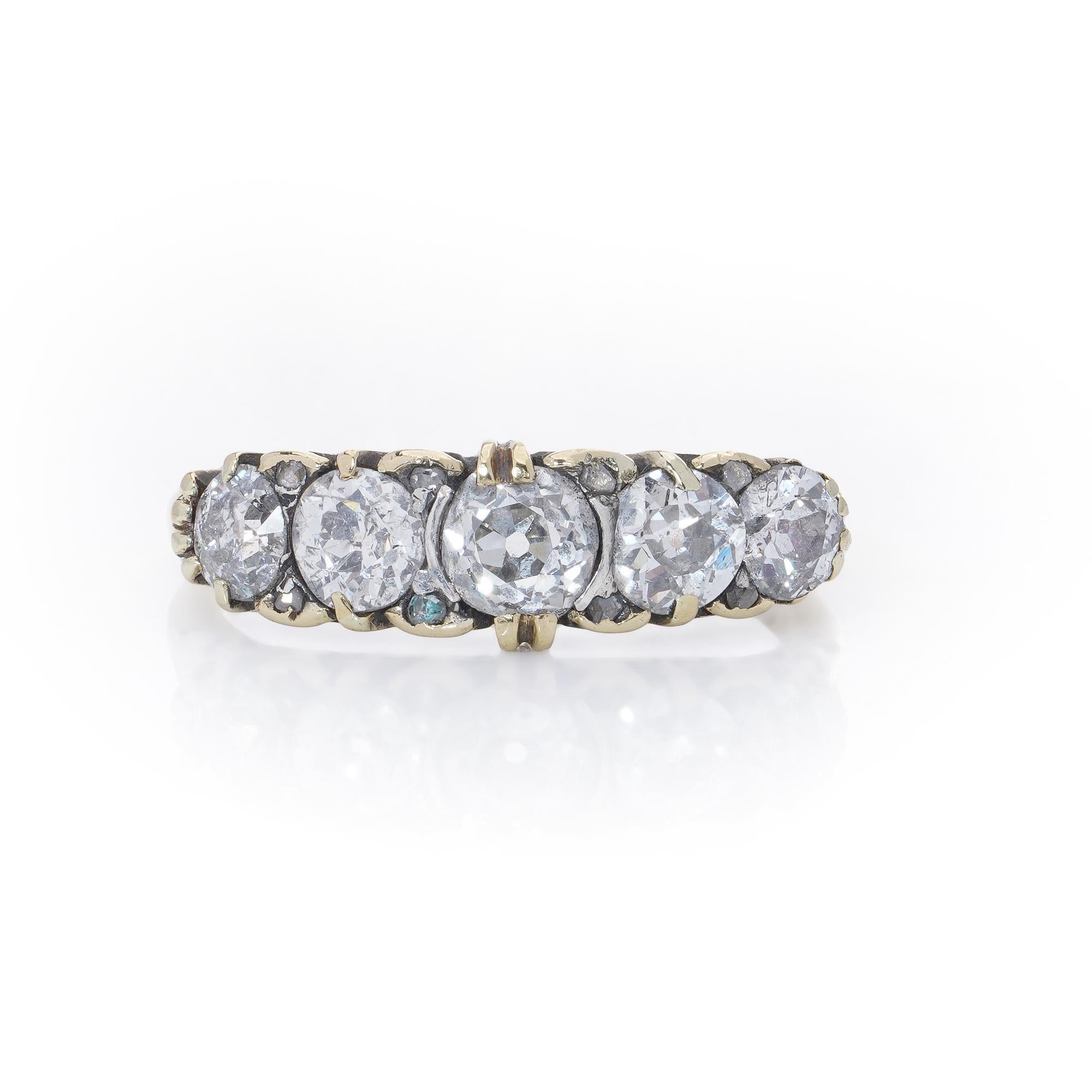 Victorian 18kt Gold Diamond Five-Stone Ring
Circa 1880's

An exquisite Victorian-era five-stone diamond ring crafted in 18kt gold, featuring old round cut diamonds with intricate scrollwork detailing along the band.

Dimensions and Details:
Gold