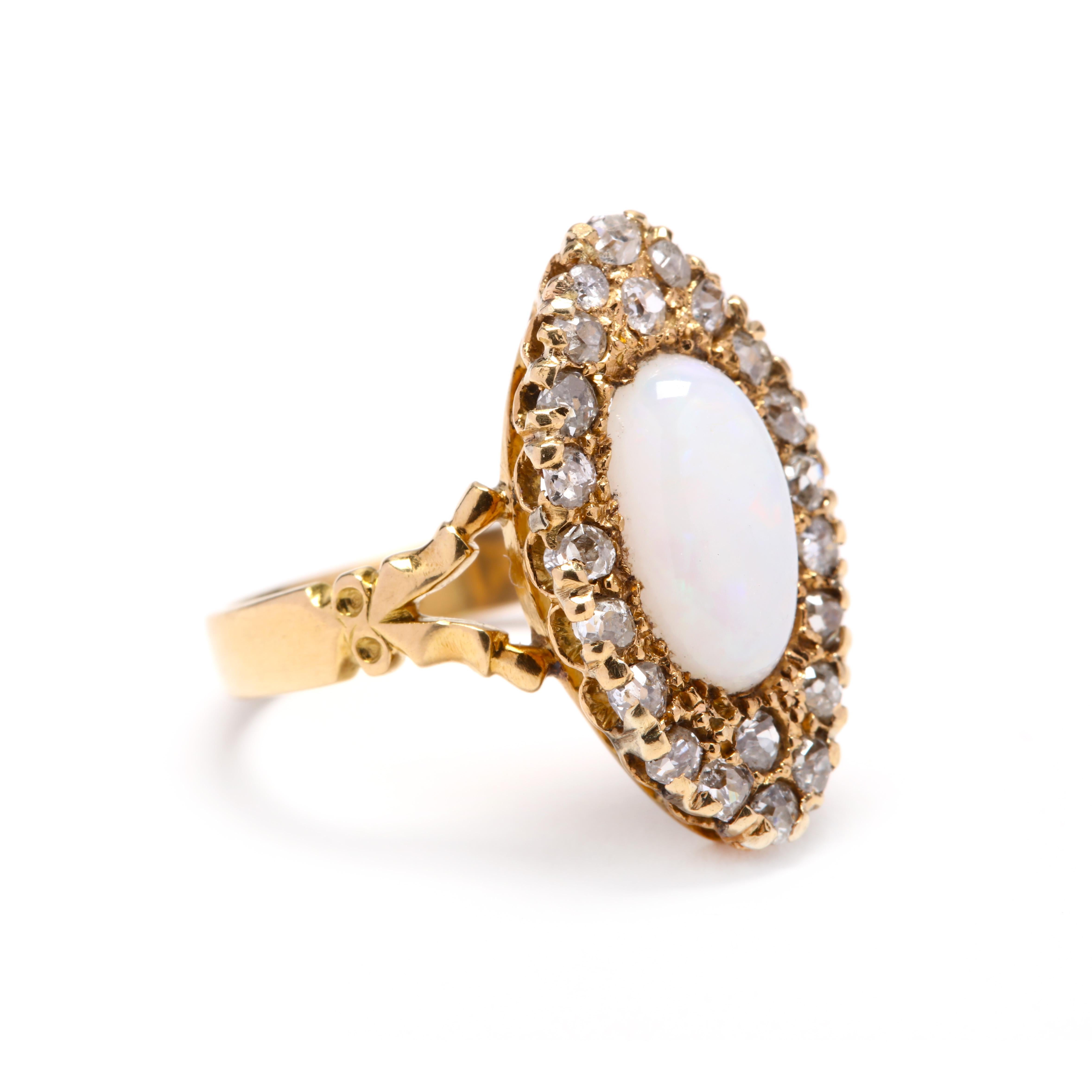 Victorian 18 karat gold navette ring centered on an oval, cabochon opal weighing approximately 1.64 carats, surrounded by old rose cut diamonds weighing approximately .66 total carats (I - L color, VS-SI clarity), with a split shank and with British