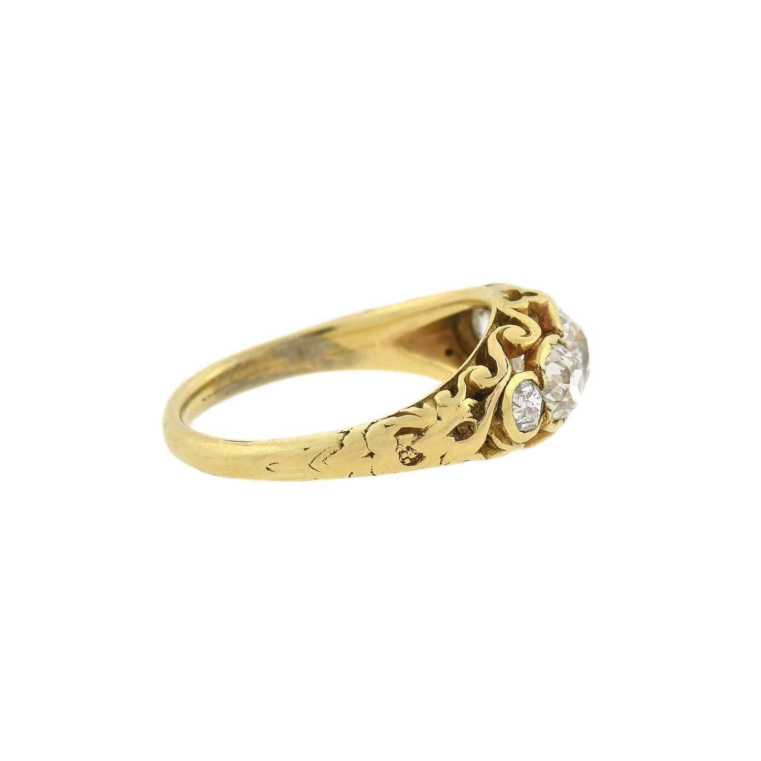 A gorgeous Victorian (ca1880s) era diamond ring! Crafted in 18kt yellow gold, this stunning piece has a beautiful graduated 5-stone design. An 0.95ct Old Mine Cut Cushion rests at the center of the ring, flanked by two Old Mine Cut diamonds on each