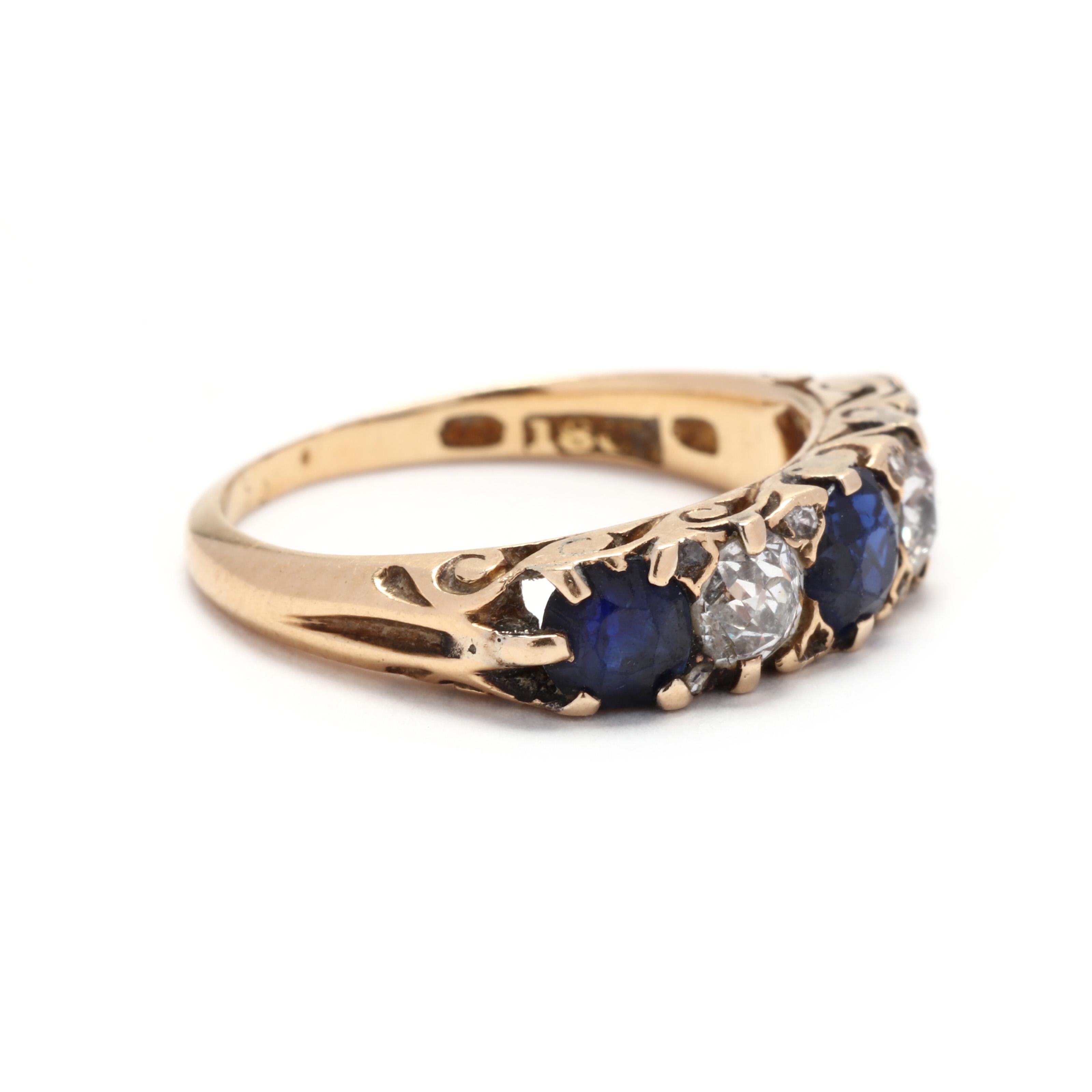 A Victorian 18 karat yellow gold diamond and sapphire five stone band. This stackable band features alternating round cut sapphires weighing approximately 1.10 total carats and old European cut diamonds weighing approximately .50 total carats, with