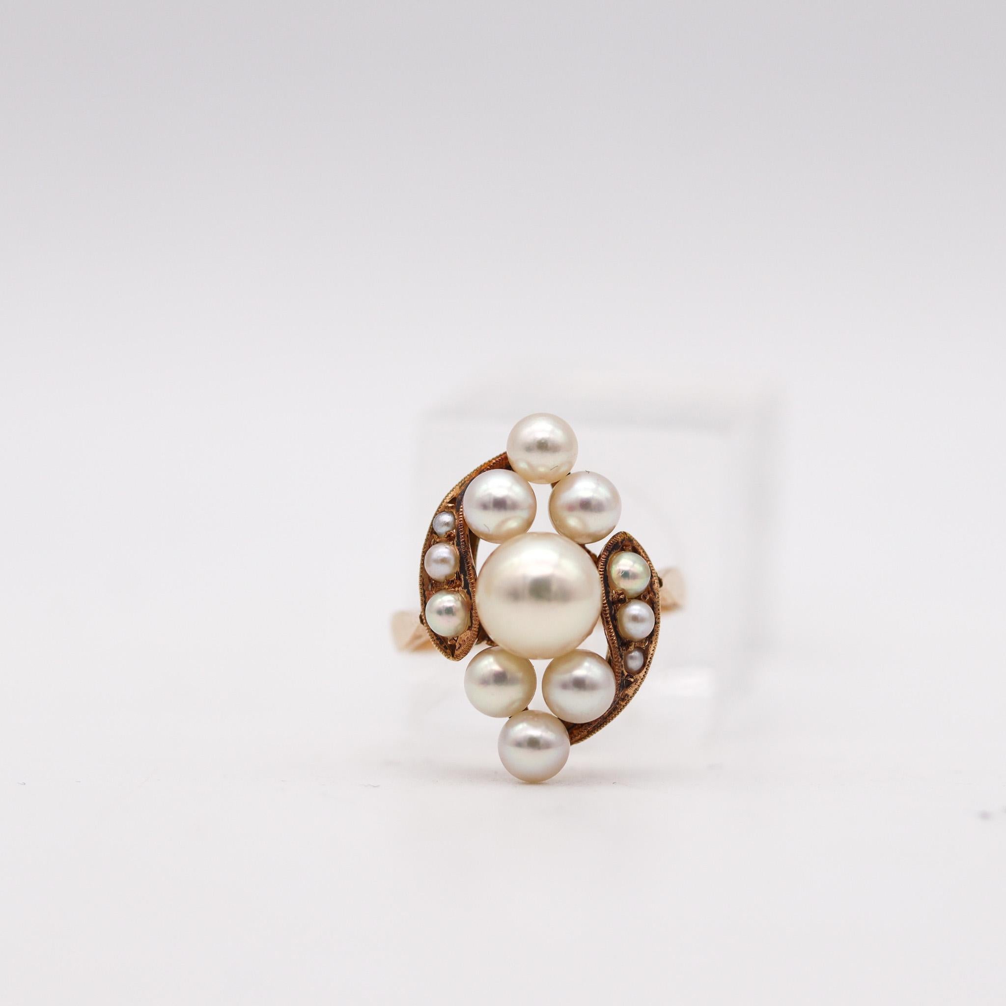 Victorian classic cluster ring with pearls.

Beautiful antique ring, created in England at the end of the Victorian period, back in the 1900. This ring has been designed with classic patterns as a cluster. It was crafted in rich yellow gold of 14