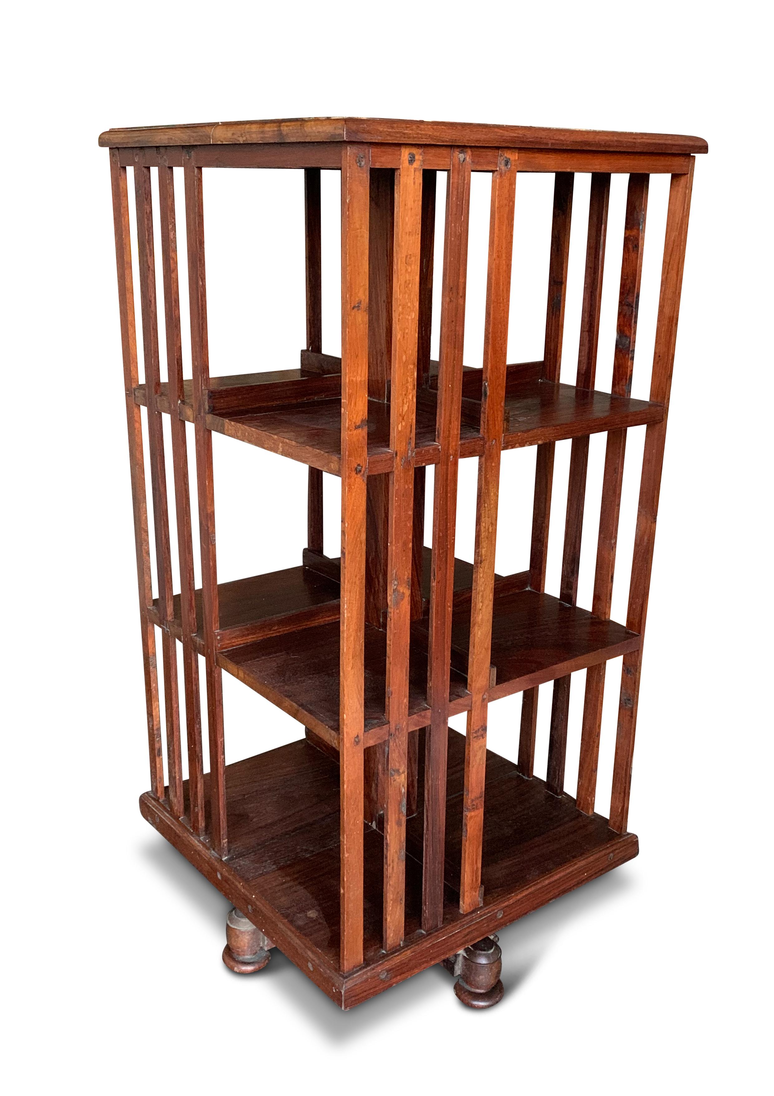 Victorian Revolving Three Tier Library Bookcase With Slatted Sections On A Graduated X Frame Revolving Base.

   