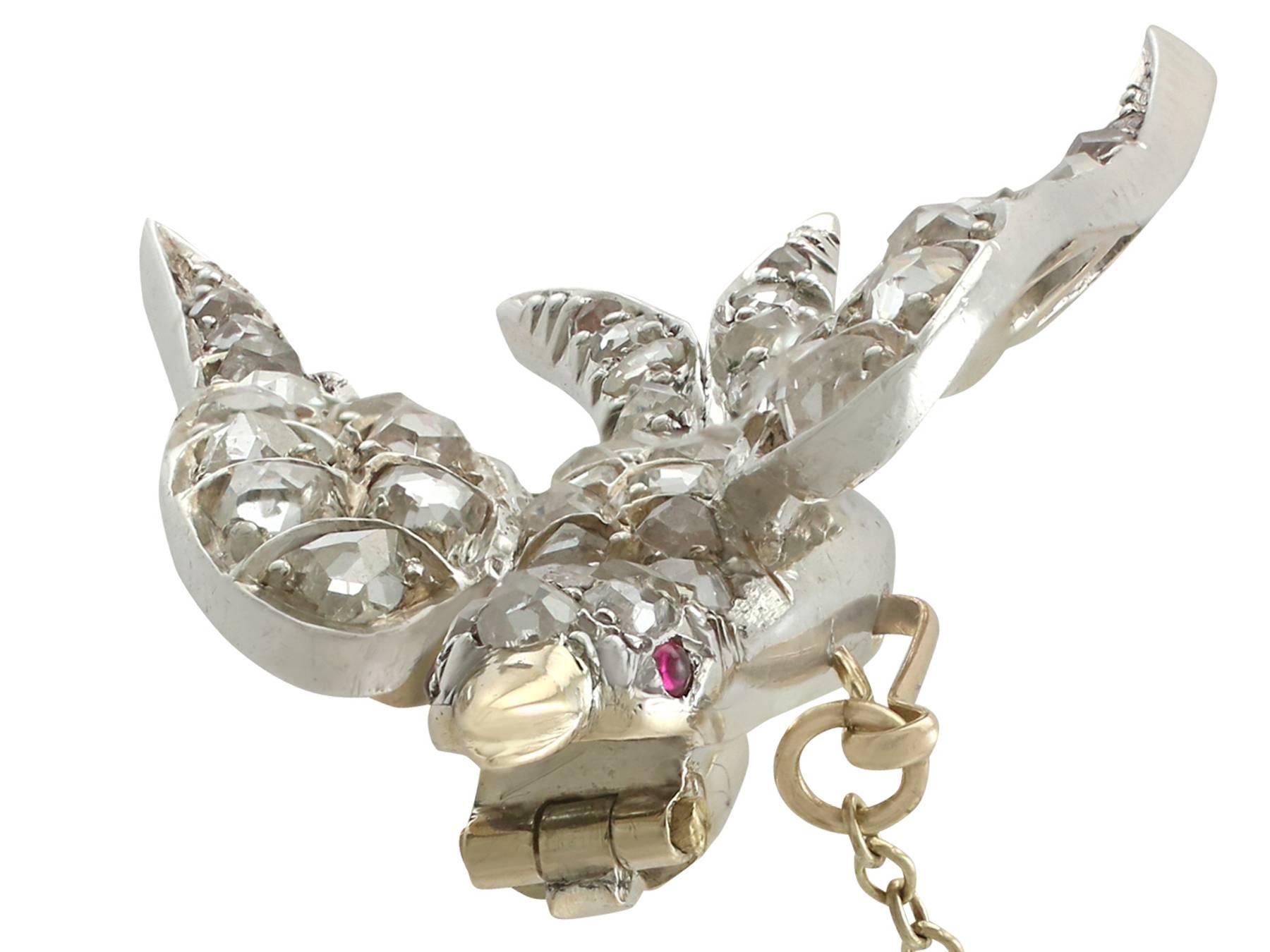 A stunning Victorian 1.95 carat diamond and 0.03 carat ruby, 9 karat yellow gold and silver set 'swallow' brooch; part of our diverse antique jewelry and estate jewelry collections.

This stunning, fine and impressive Victorian swallow brooch has
