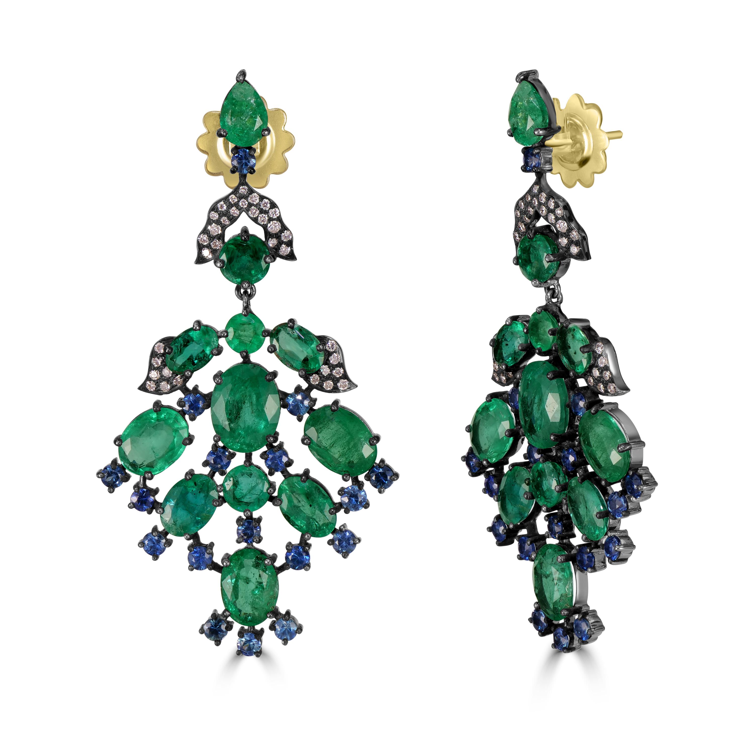 Indulge in the opulence of our Victorian 19.68 Cttw. Emerald, Blue Sapphire, and Diamond Dangle Earrings—a testament to the timeless allure of precious gemstones and exquisite craftsmanship. The drop of these earrings is a mesmerizing assembly of