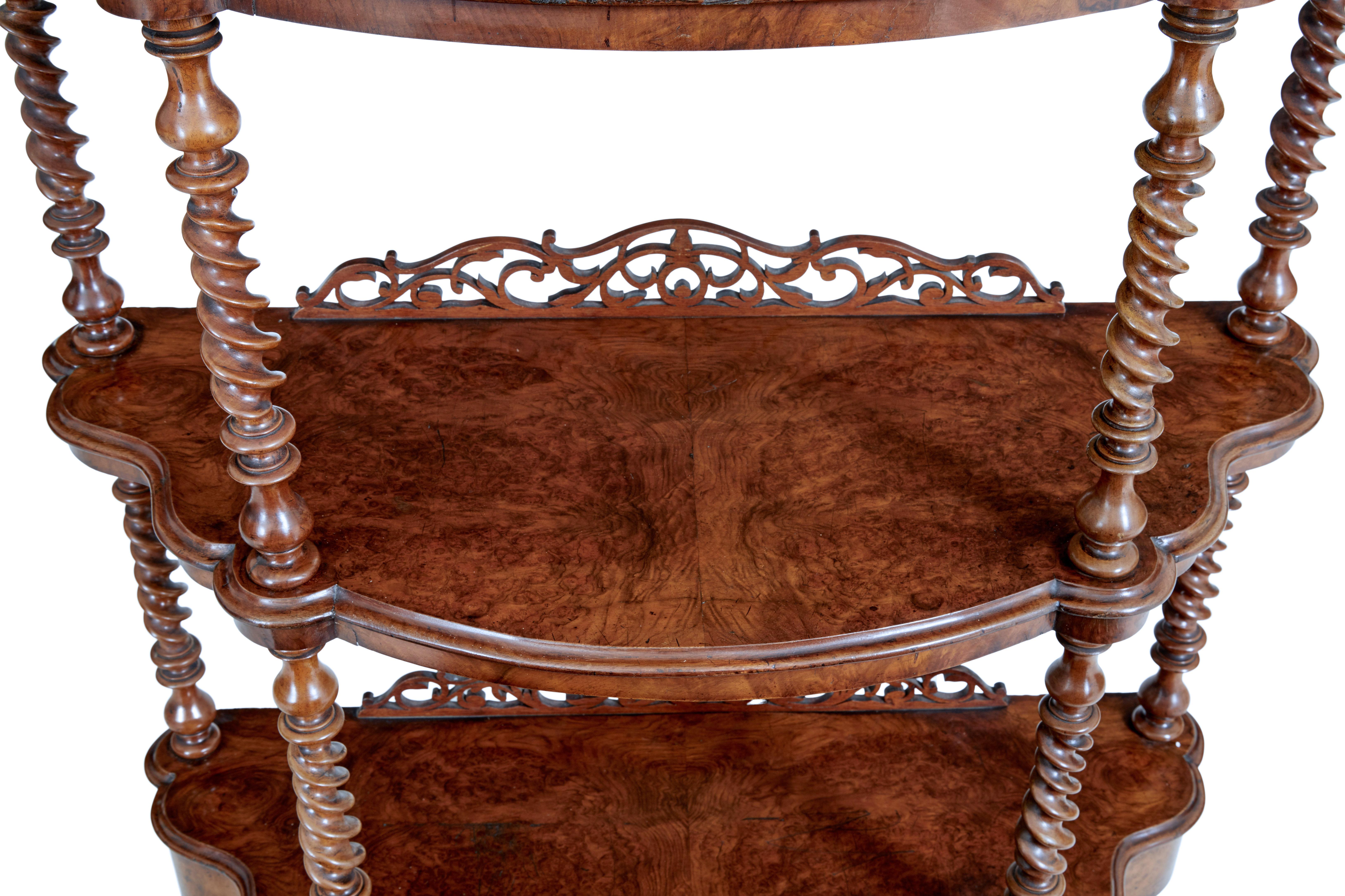 19th century walnut victorian what not stand, circa 1870.

Good quality walnut what not. Beautifully veneered in burr walnut. 3 tiers, top tier with mirror and applied ornate carving. United by turned twists. Drawer in the base, standing on