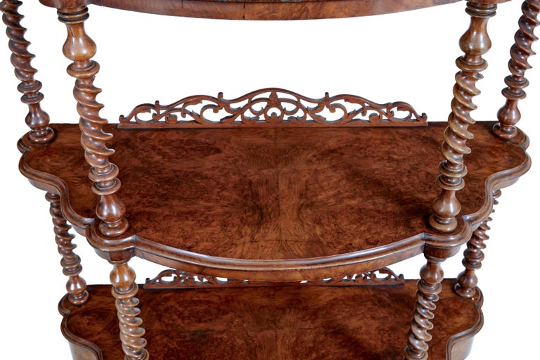 19th century walnut victorian what not stand, circa 1870.

Good quality walnut what not. Beautifully veneered in burr walnut. 3 tiers, top tier with mirror and applied ornate carving. United by turned twists. Drawer in the base, standing on