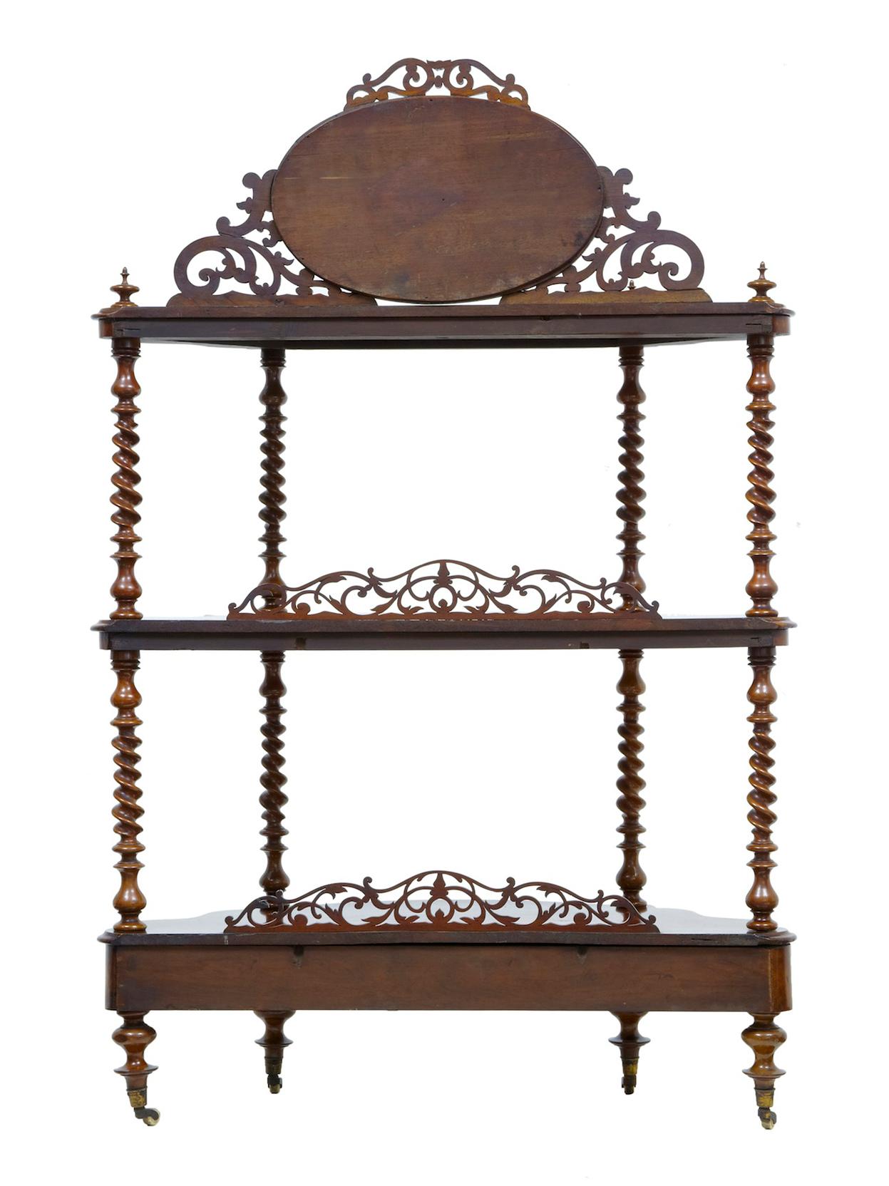 19th Century walnut Victorian what not stand, circa 1870.

Good quality walnut what not. Beautifully veneered in burr walnut. 3 Tiers, top tier with mirror and applied ornate carving. United by turned twists. Drawer in the base, standing on