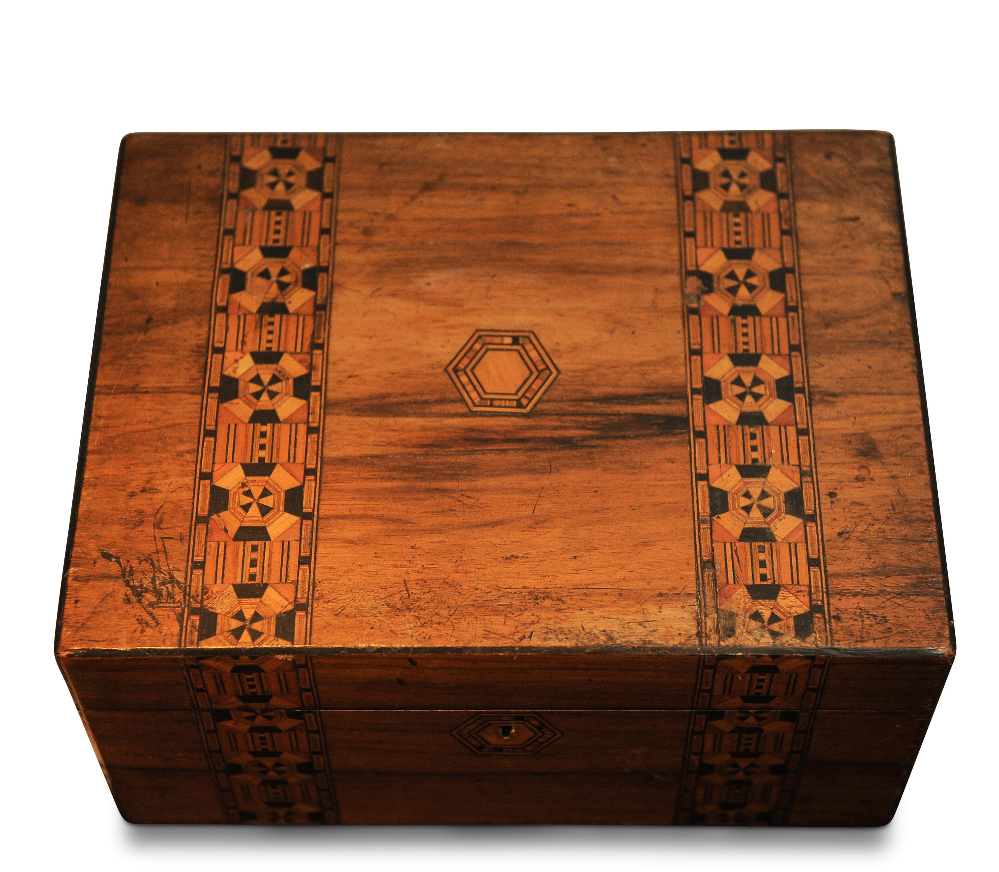 Victorian 19th century Tunbridge ware sewing box with original sewing items. Sectional compartments, lift off shelf and storage below. Item has had no restoration and would appear to be the same as it was in the 1800s. Has a ruched red silk lining