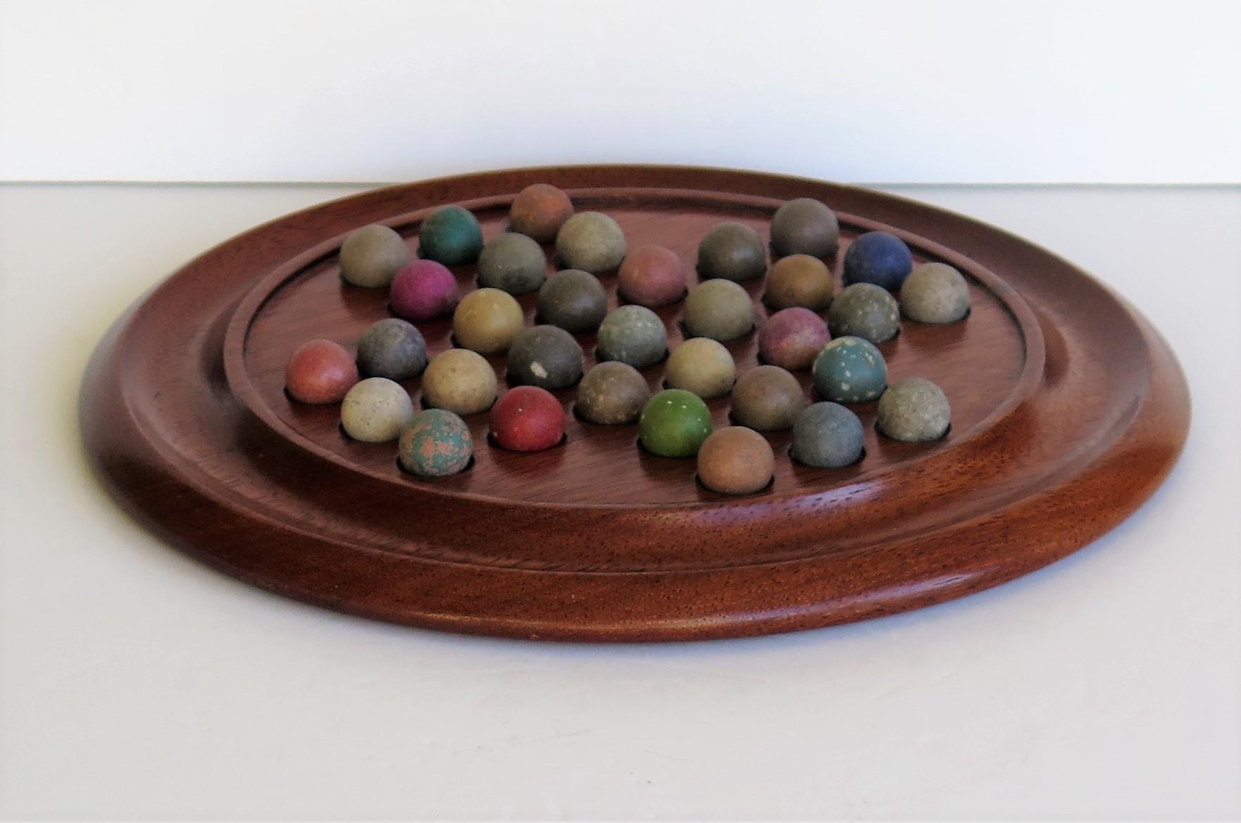 Folk Art Victorian Marble Solitaire Game with Walnut Board and 33 Handmade Marbles