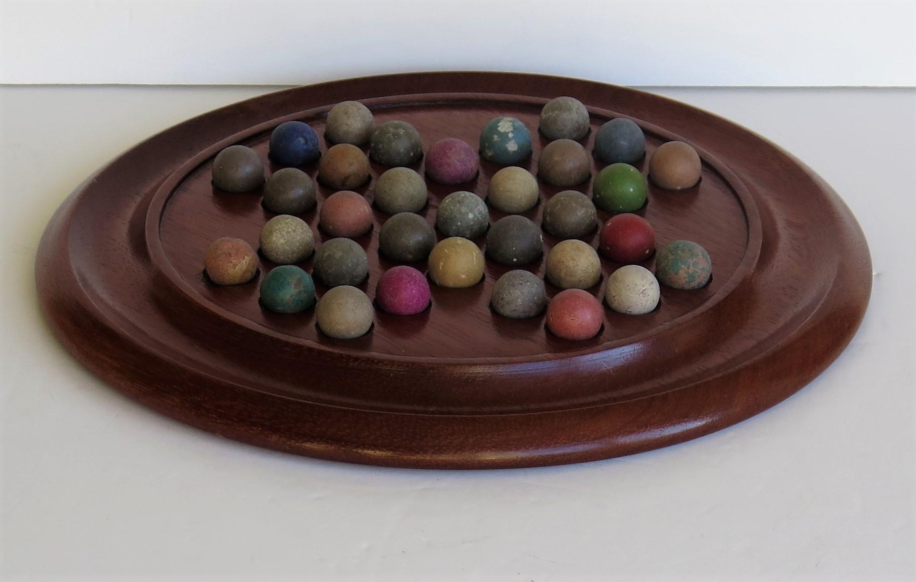 English Victorian Marble Solitaire Game with Walnut Board and 33 Handmade Marbles