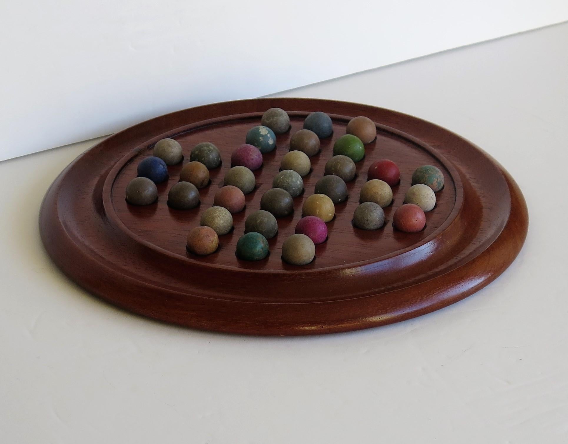 Hand-Crafted Victorian Marble Solitaire Game with Walnut Board and 33 Handmade Marbles