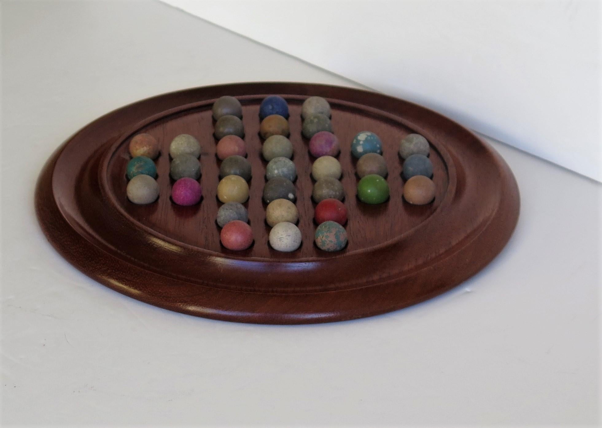 Victorian Marble Solitaire Game with Walnut Board and 33 Handmade Marbles In Good Condition In Lincoln, Lincolnshire