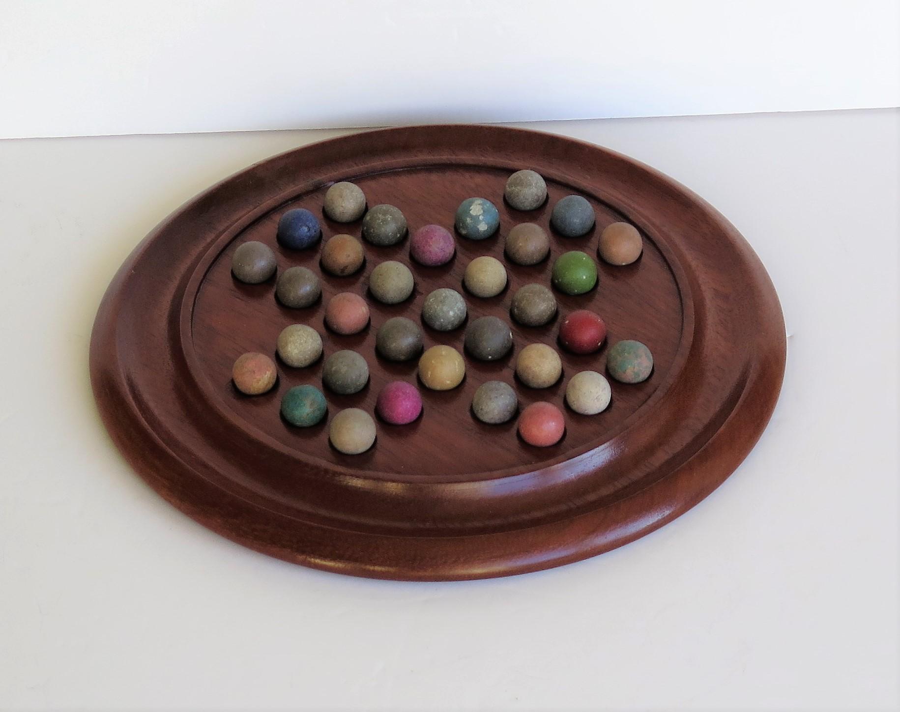 19th Century Victorian Marble Solitaire Game with Walnut Board and 33 Handmade Marbles