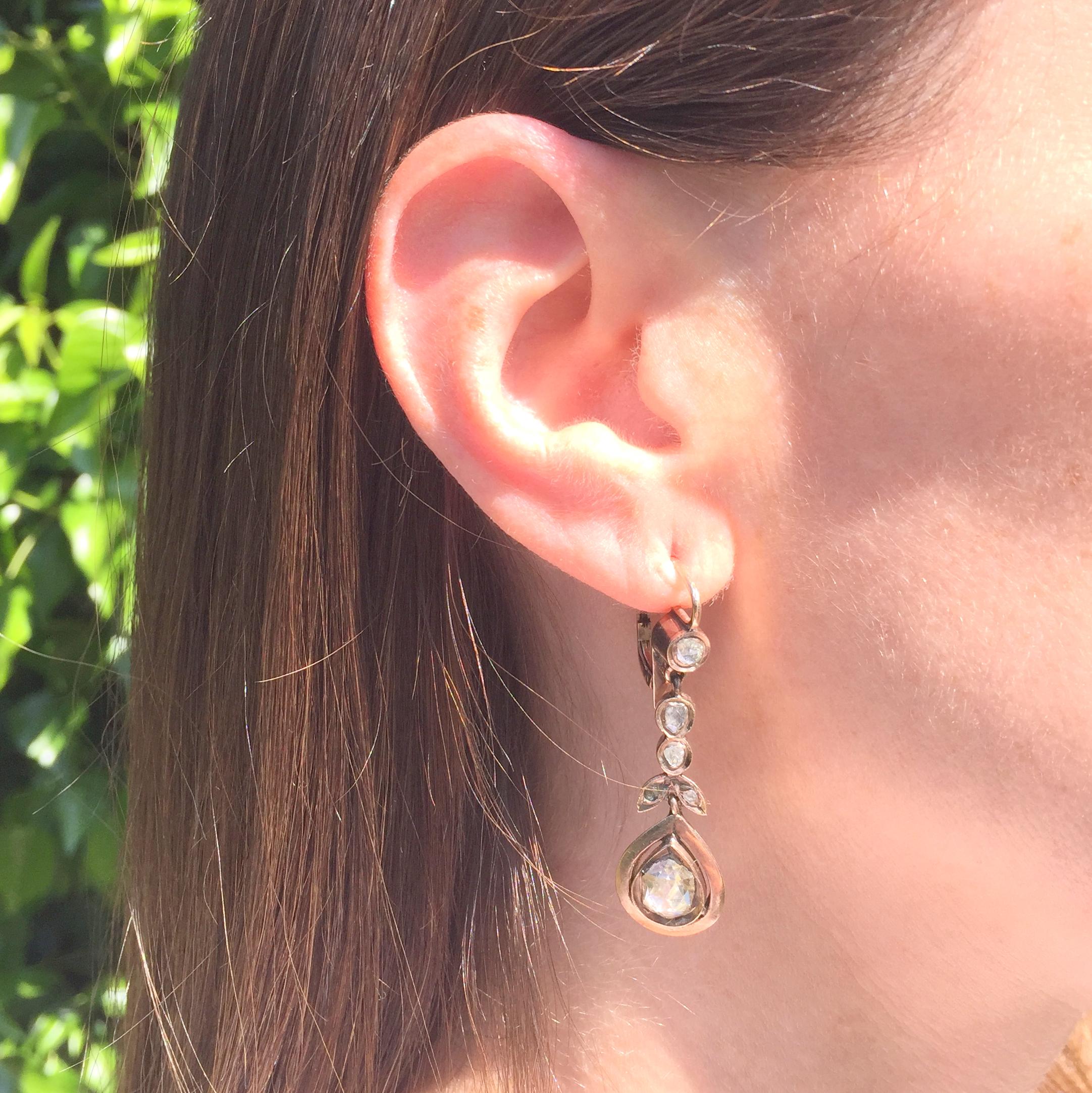 It’s virtually impossible to not be won over by these glorious mid-Victorian rose cut diamond drop earrings. The top part of the earring, set with one rose cut diamond, is connected via a linking bar of four rose cut diamonds in a foliate formation