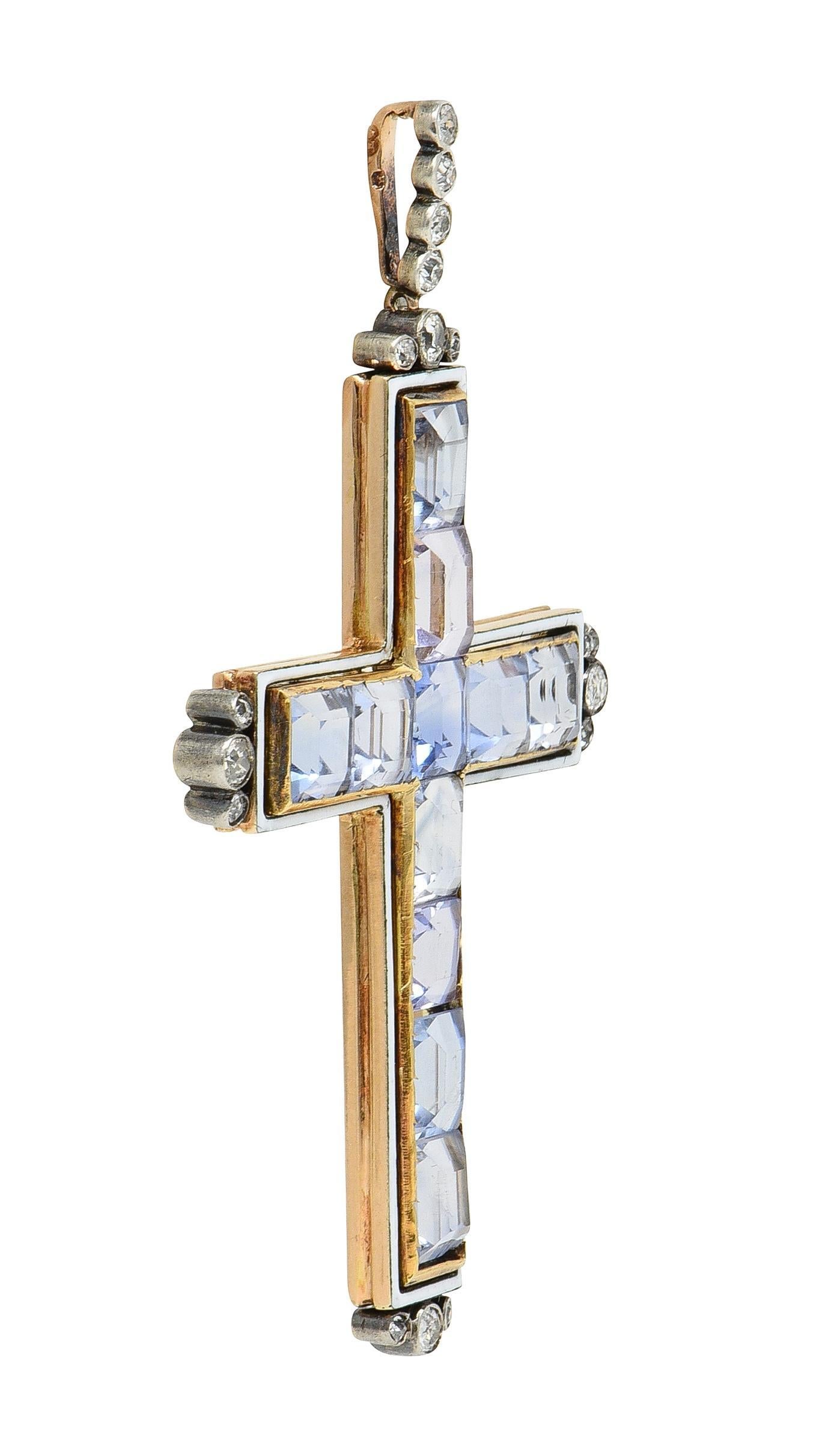 Featuring rectangular mixed-cut sapphires channel set in cross-formation
Weighing approximately 20.24 carats total - ranging in color 
Transparent light grayish blue, light blue, and light lavender 
With a floating halo of opaque white enamel -